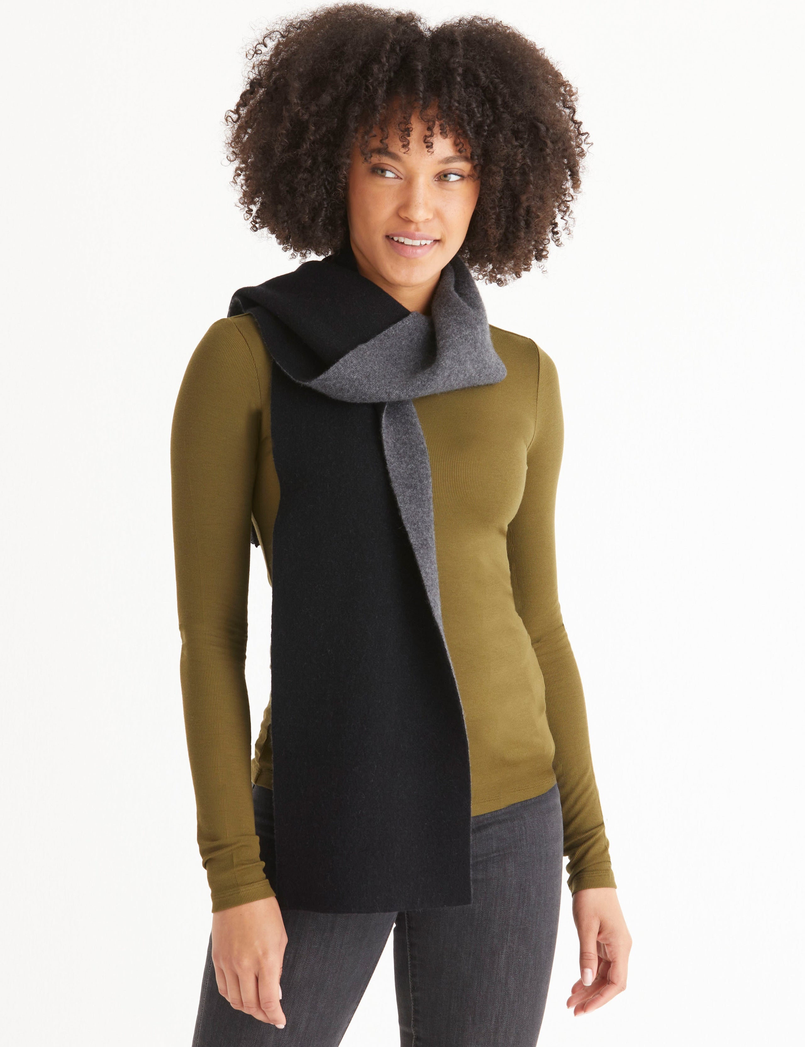 Front full-body view of woman wearing Avesta Cashmere Scarf in Onyx Black from AETHER Apparel.