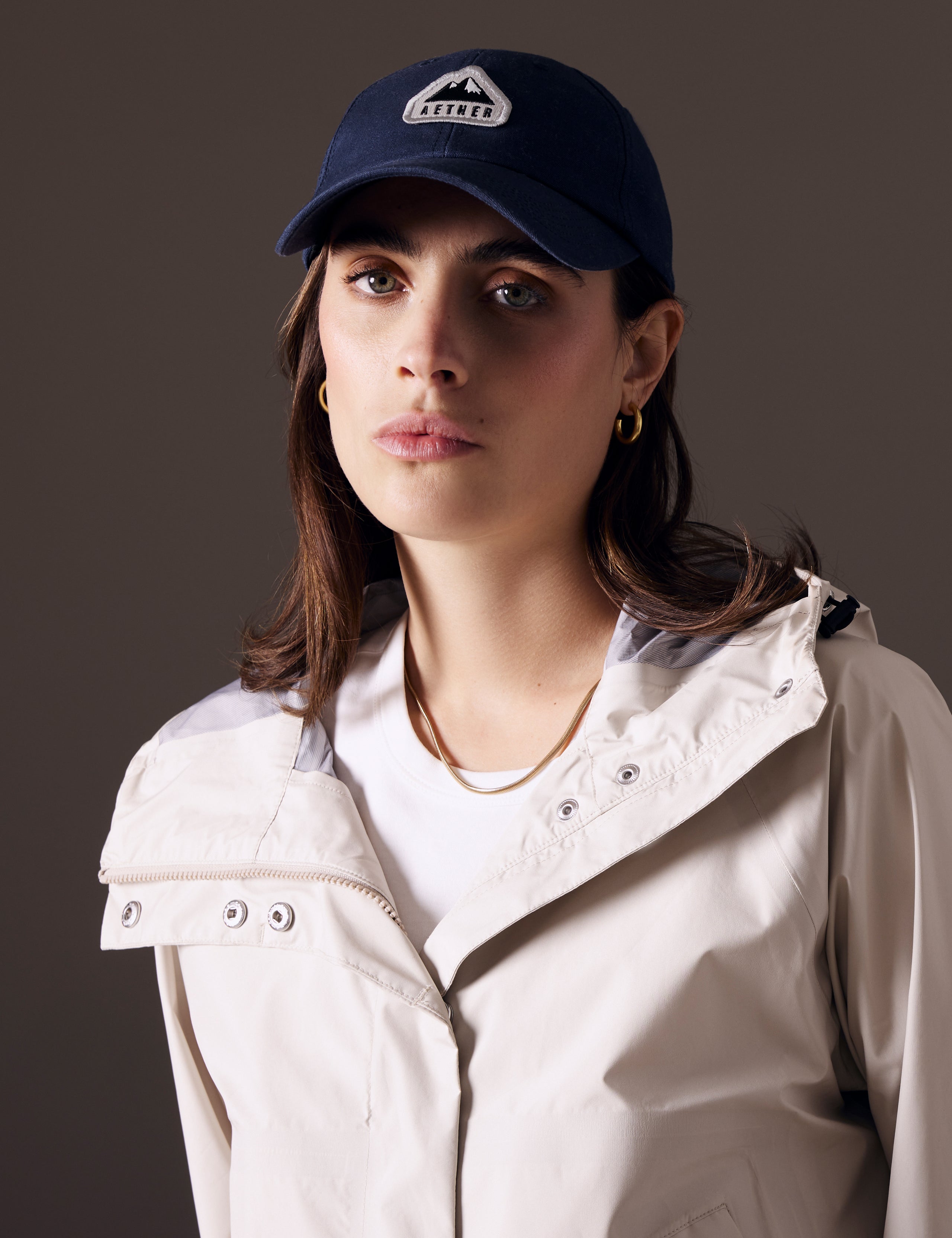 Front view of woman wearing AETHER Mountain Hat in Nordic Navy blue from AETHER Apparel.