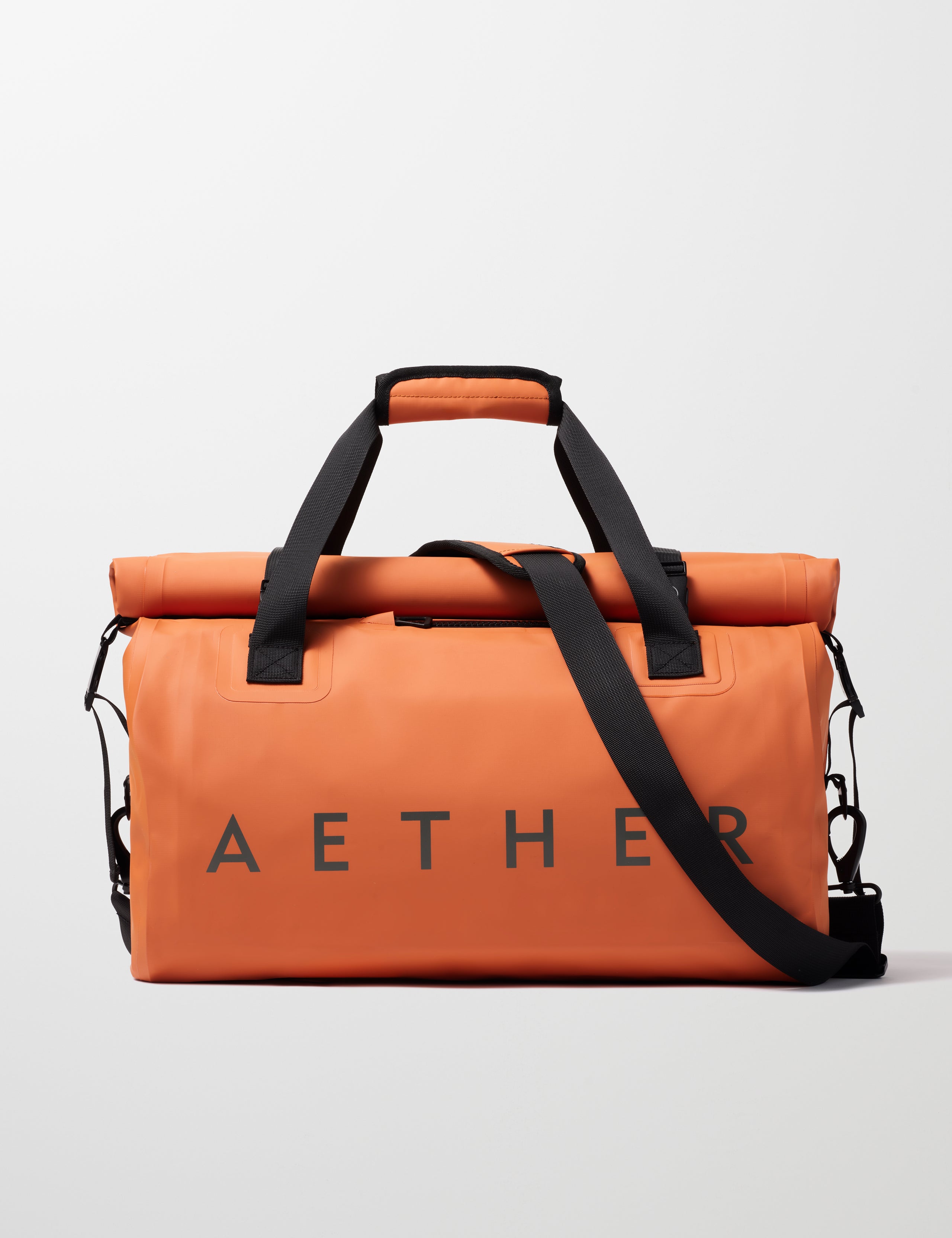 Front view of Excursion Duffle Bag 45L in Autumn Orange from AETHER Apparel.