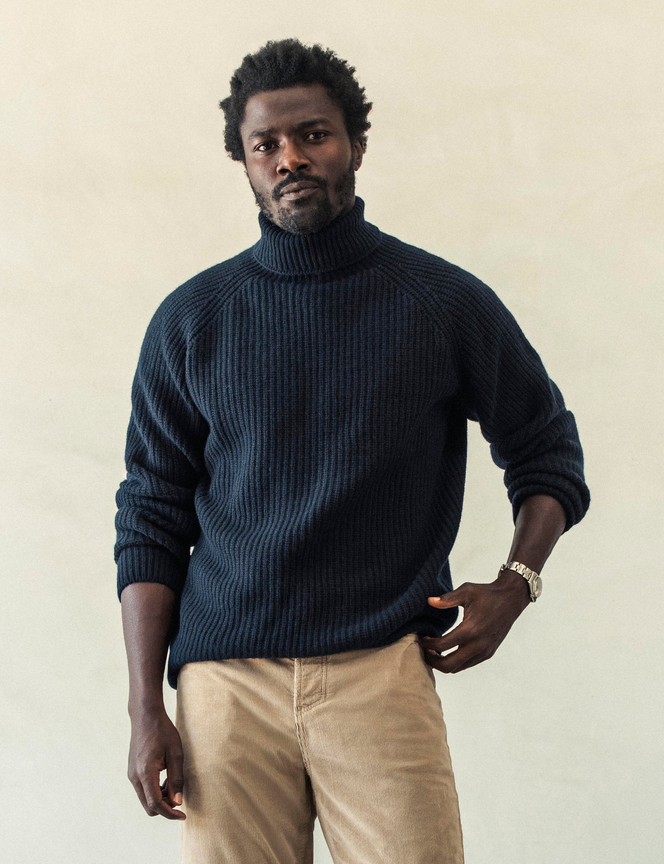 Front view of man wearing Finley Sweater in Total Eclipse dark blue from AETHER Apparel.