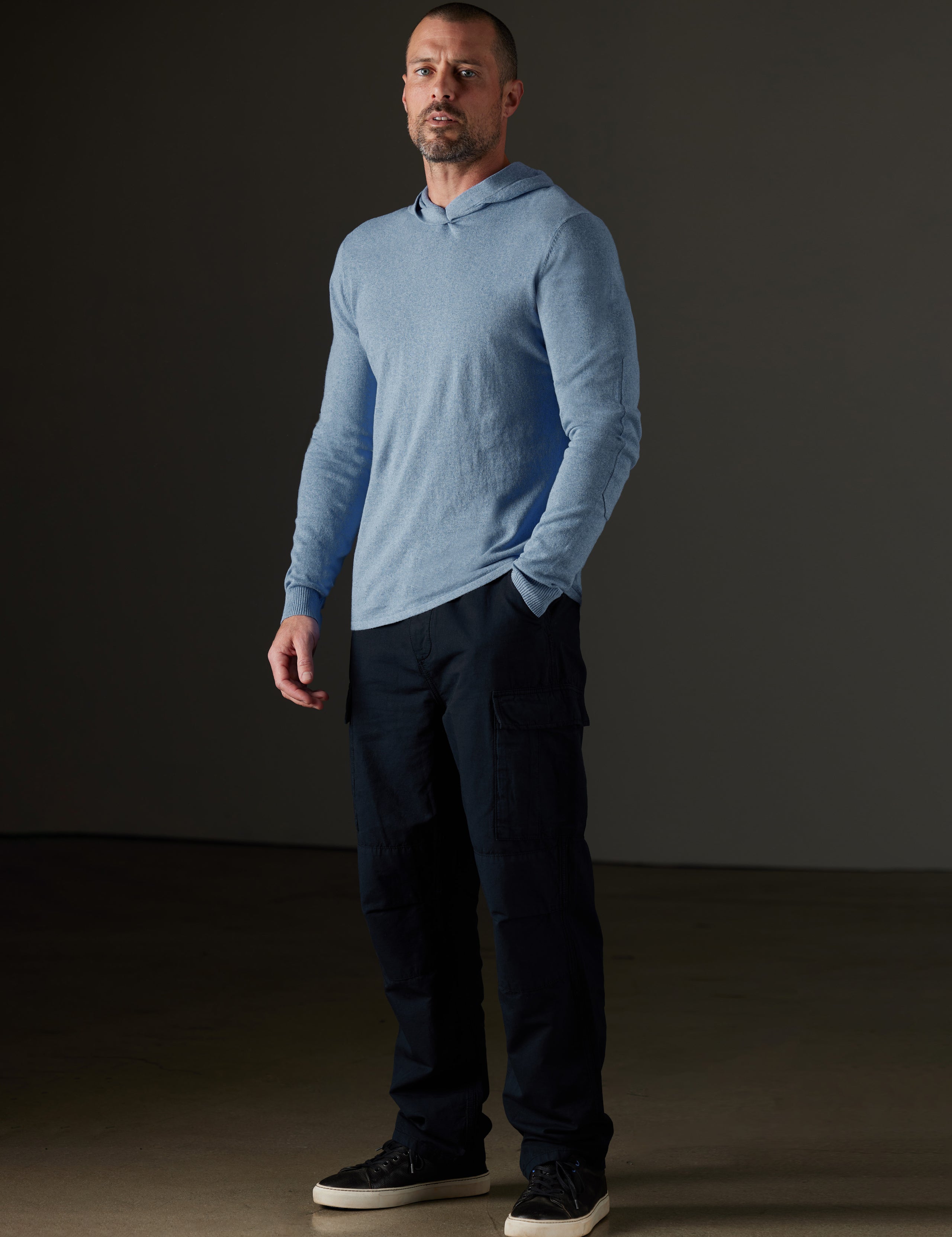 Man wearing blue hooded sweater from AETHER Apparel