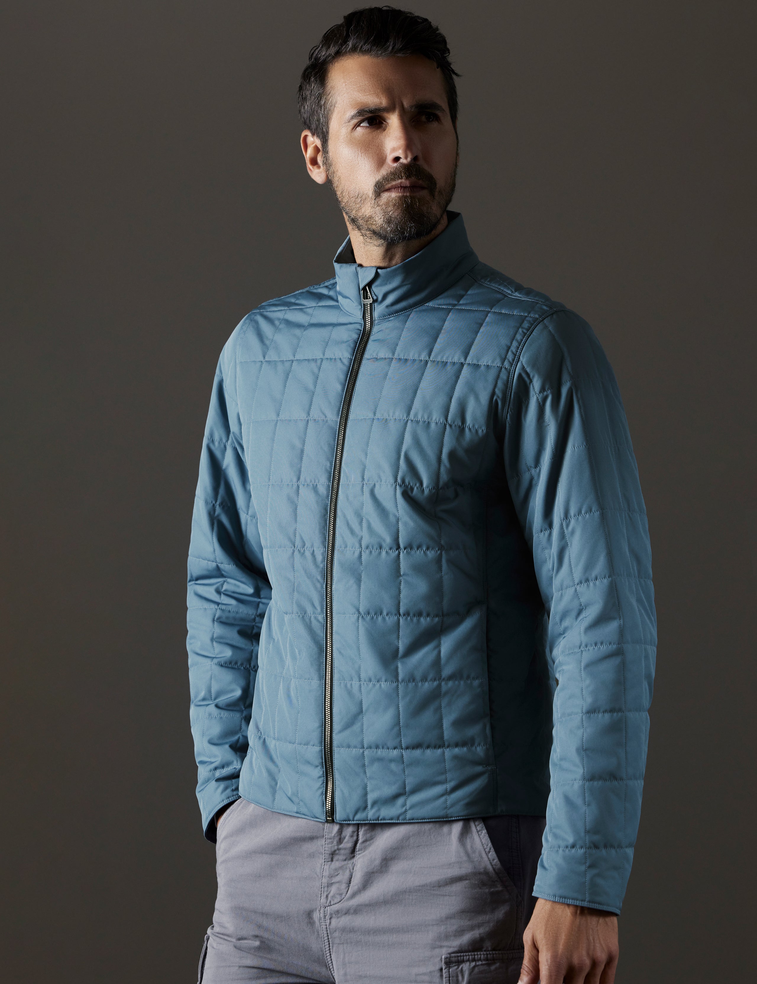 Front body view of man wearing Alto Jacket in Portal Blue from AETHER Apparel.
