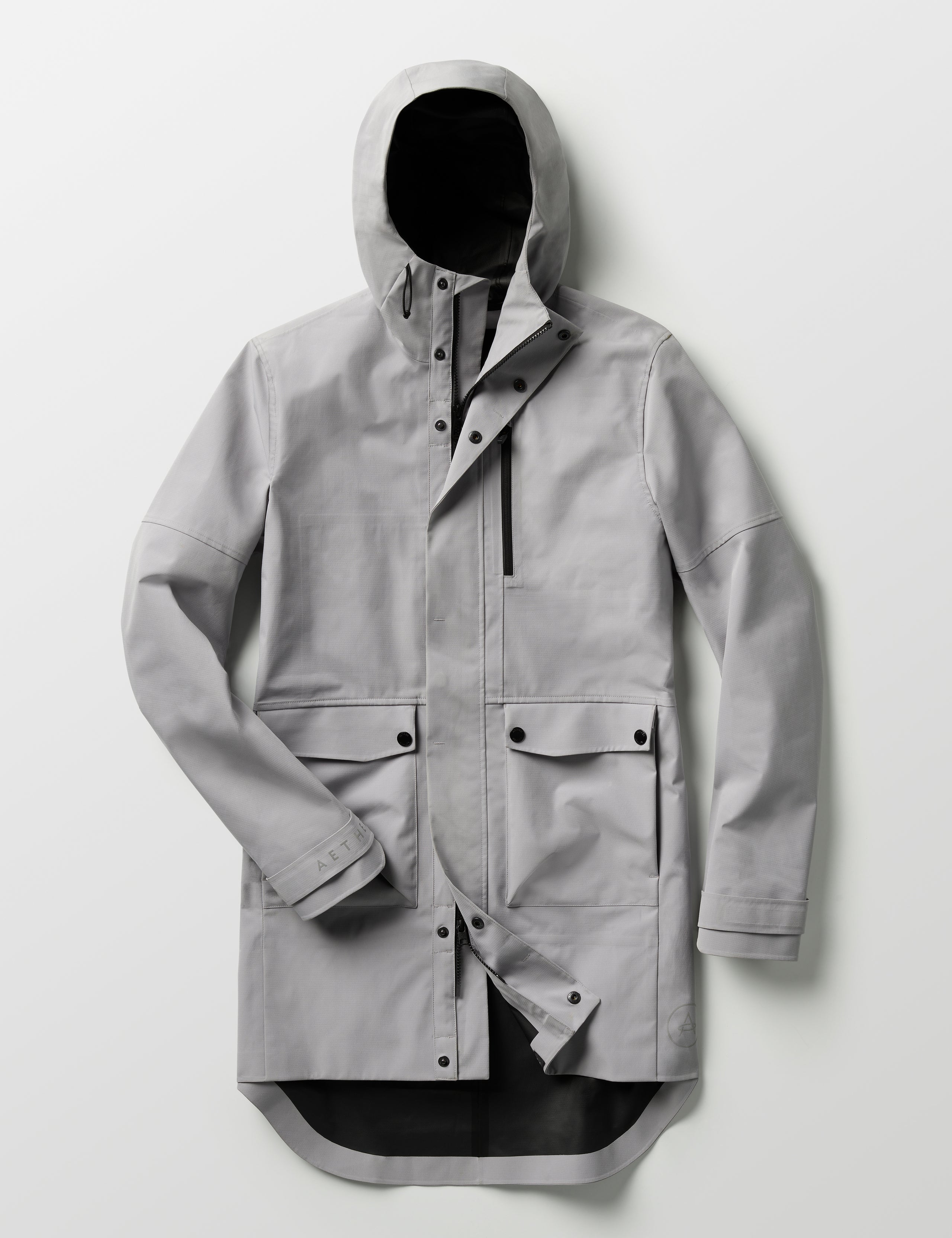 Flat lay of Anders Rain Jacket in Sky Grey from AETHER Apparel.