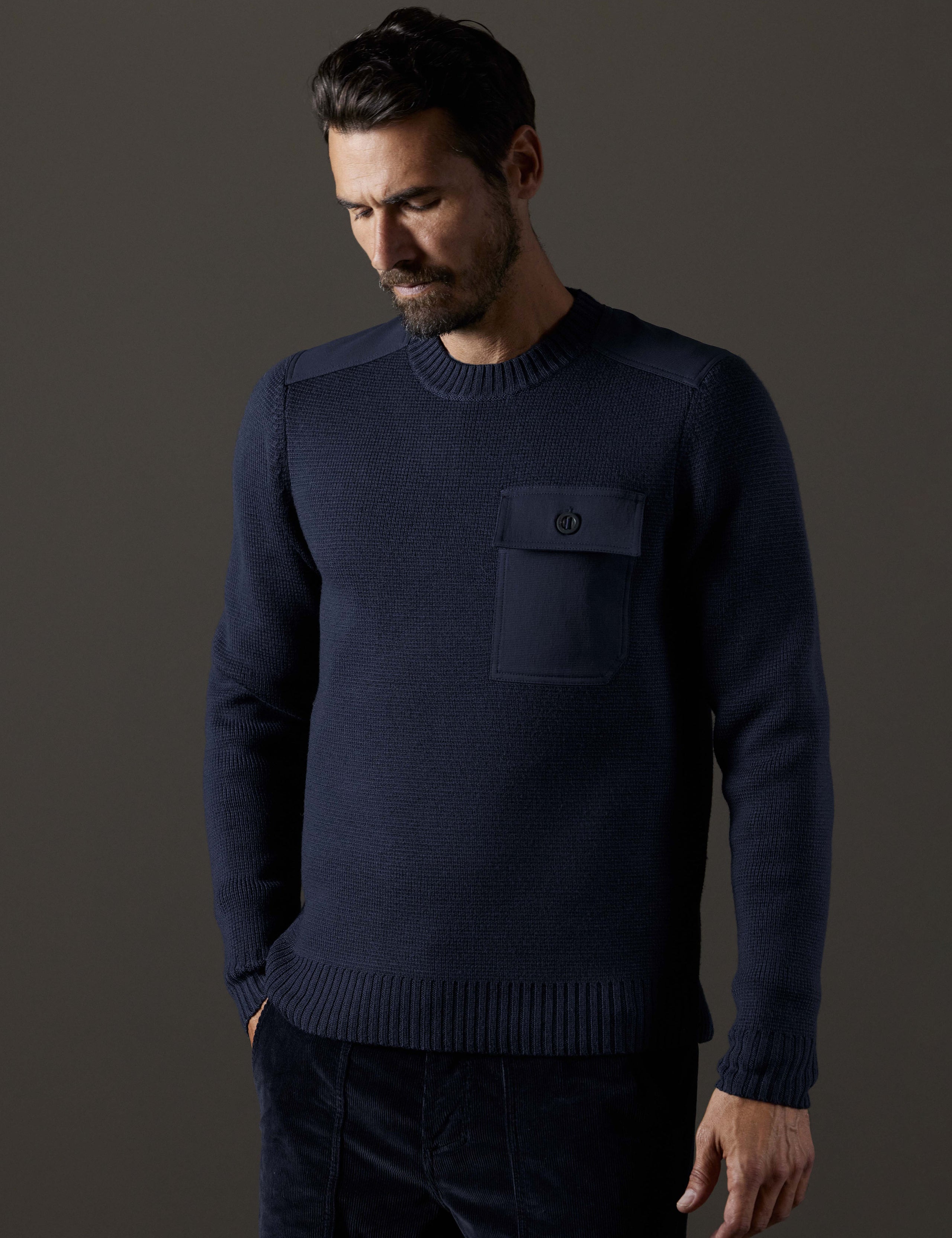 Front body view of man wearing Benson Crewneck Sweater in Total Eclipse dark blue from AETHER Apparel.