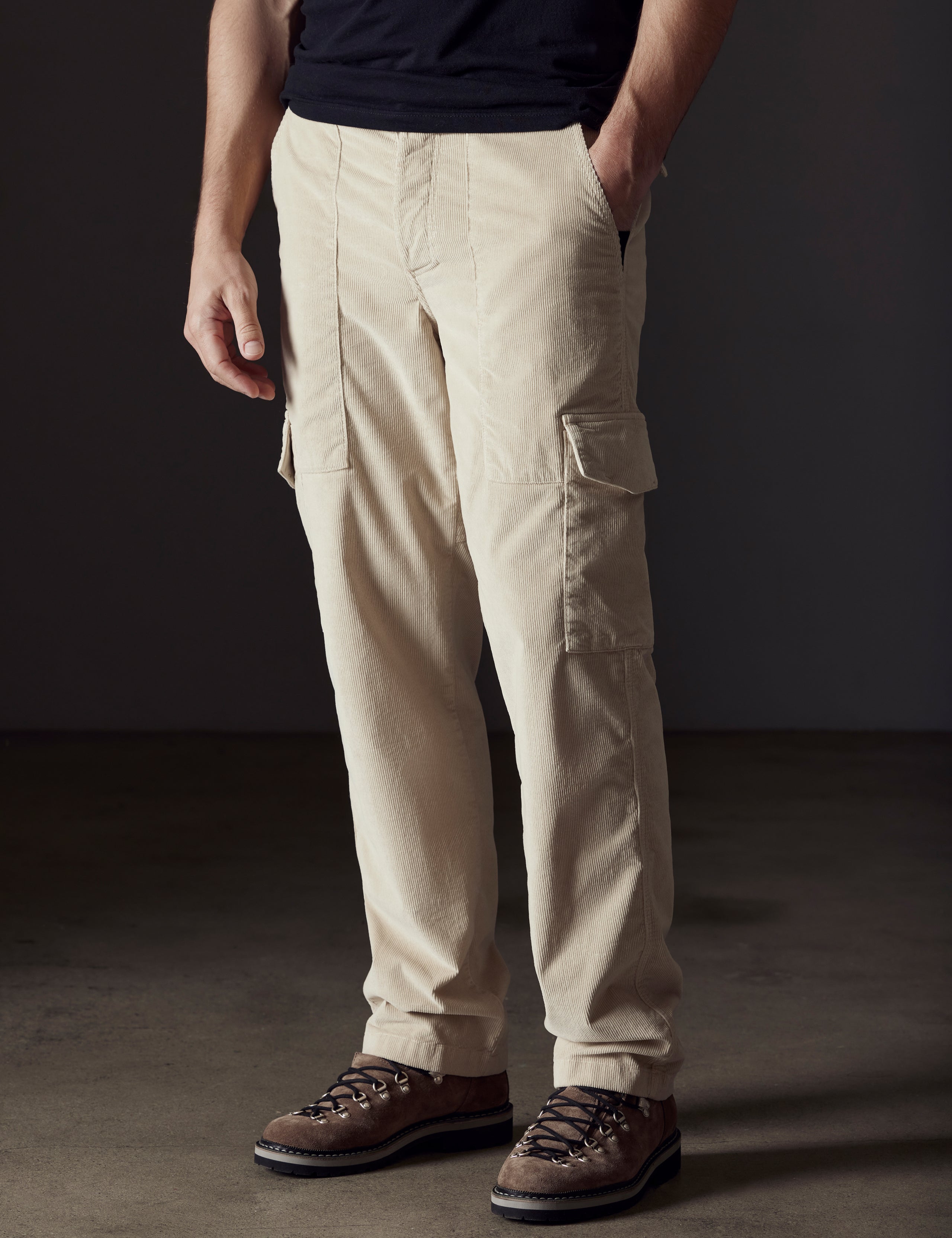 Front angled lower body view of man wearing Corduroy Fatigue Pant in Bone white from AETHER Apparel.