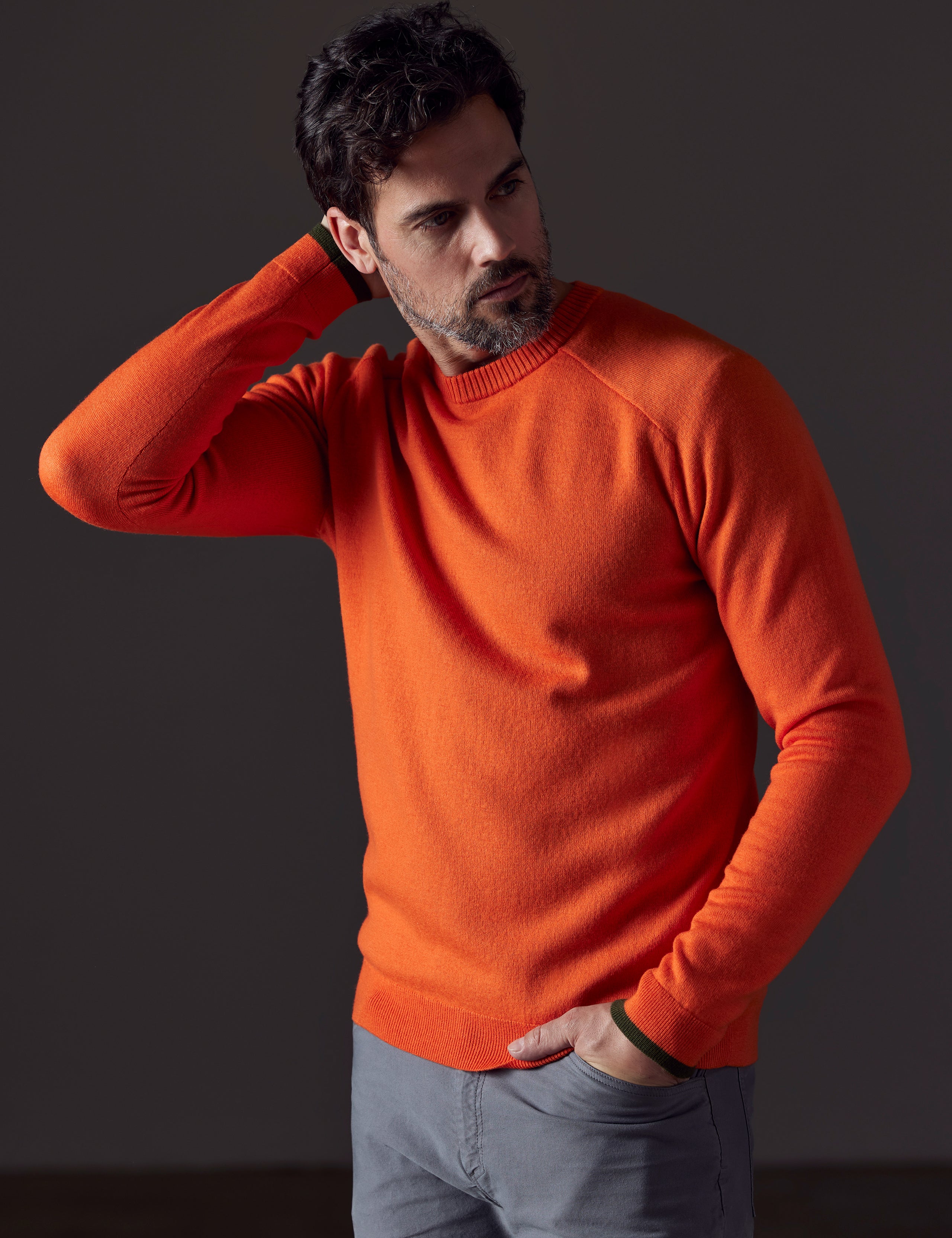 Front 3/4 body view of man wearing Corbin Sweater in Sedona Orange from AETHER Apparel.