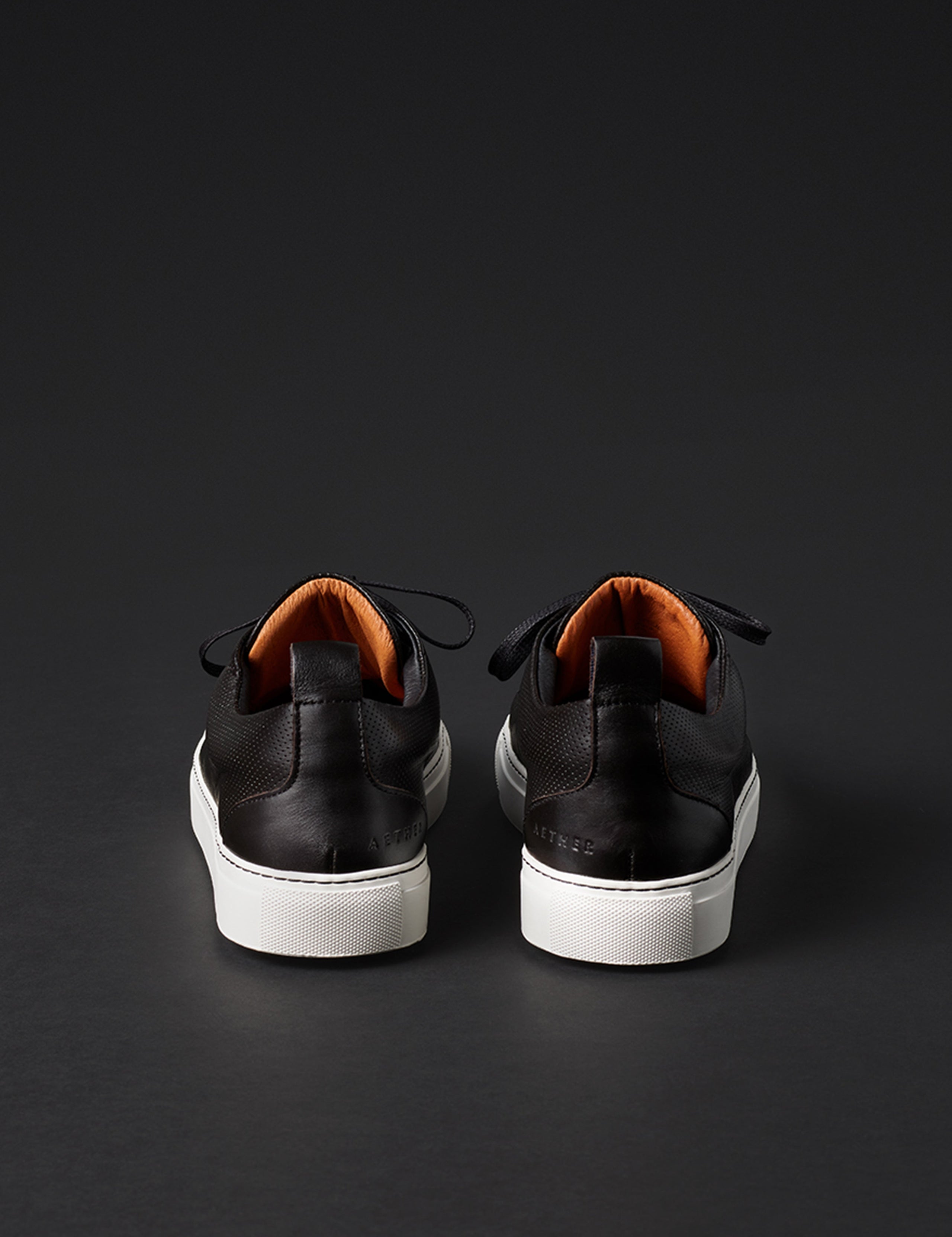 Rear view of men’s Dalton Low-Top Sneaker in Onyx Black from AETHER Apparel.