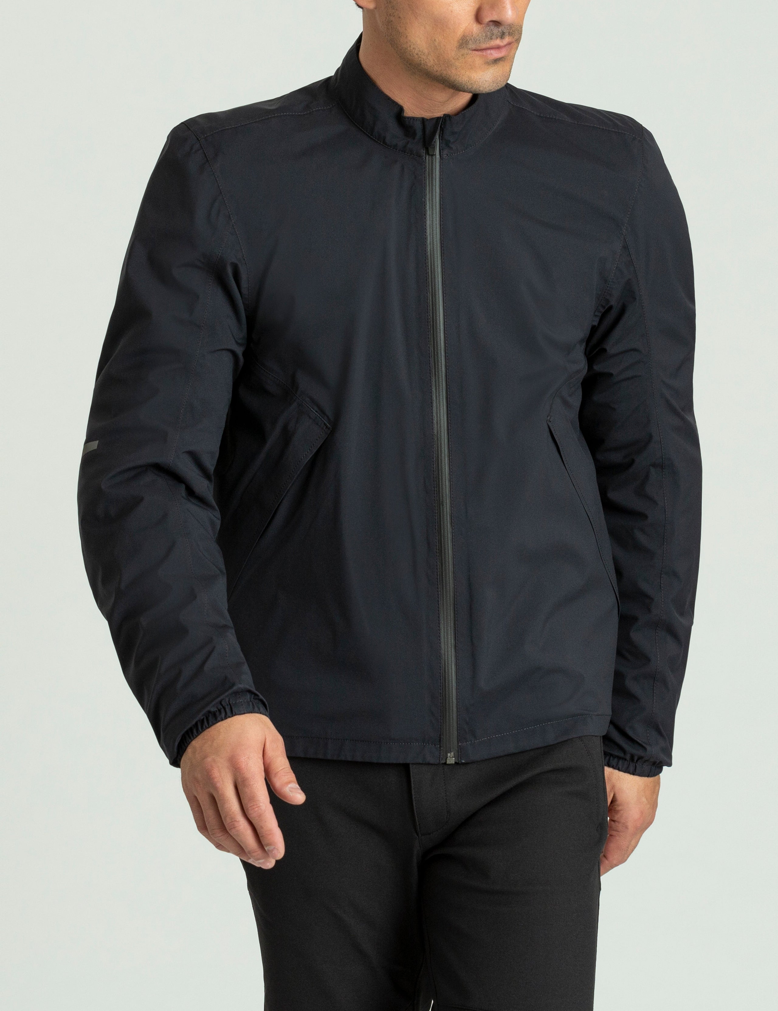 Front 3/4 body view of man wearing Draft Mesh Motorcycle Jacket in Jet Black from AETHER Apparel.
