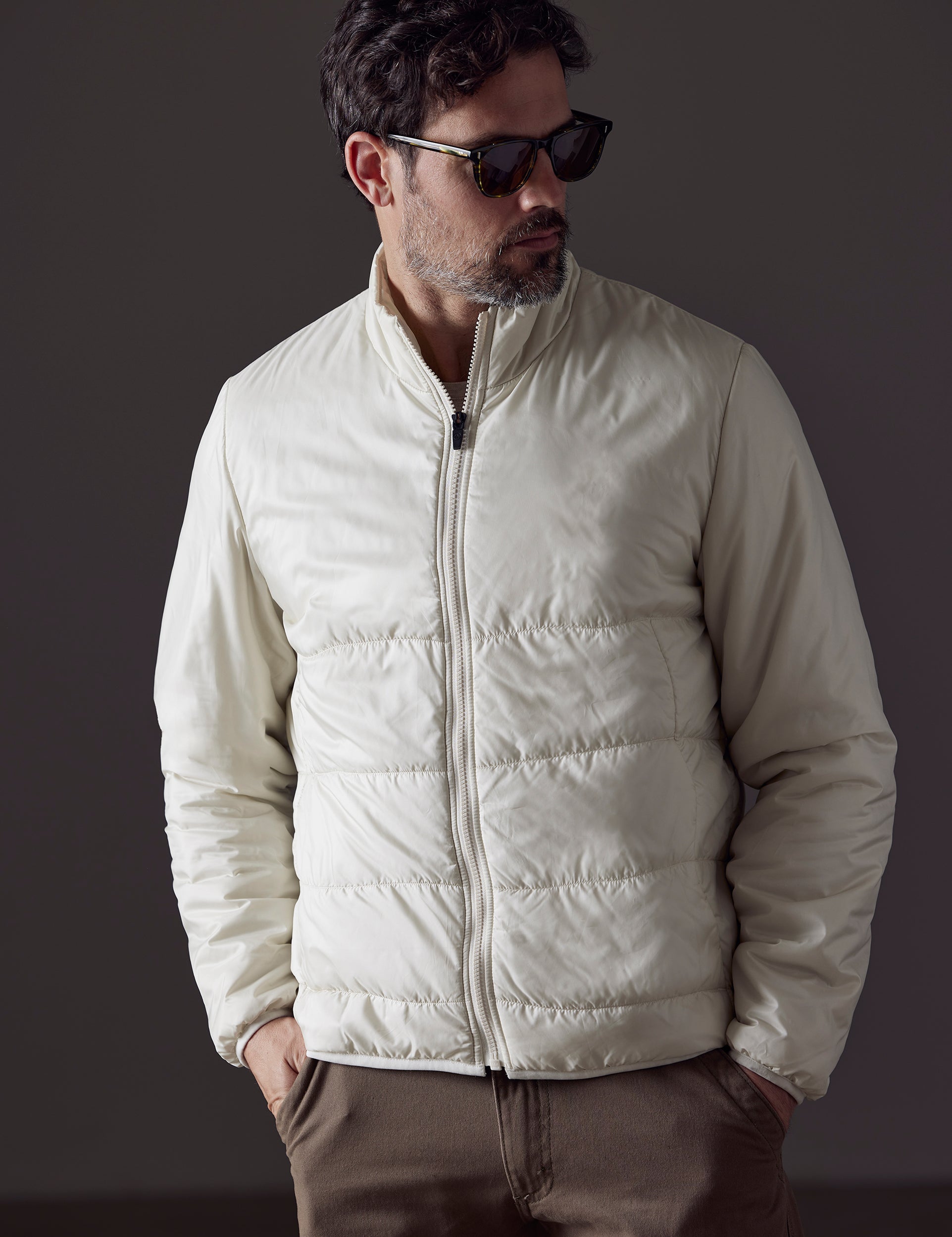 Front body view of man wearing Eco Insulated Jacket in Winter White from AETHER Apparel.