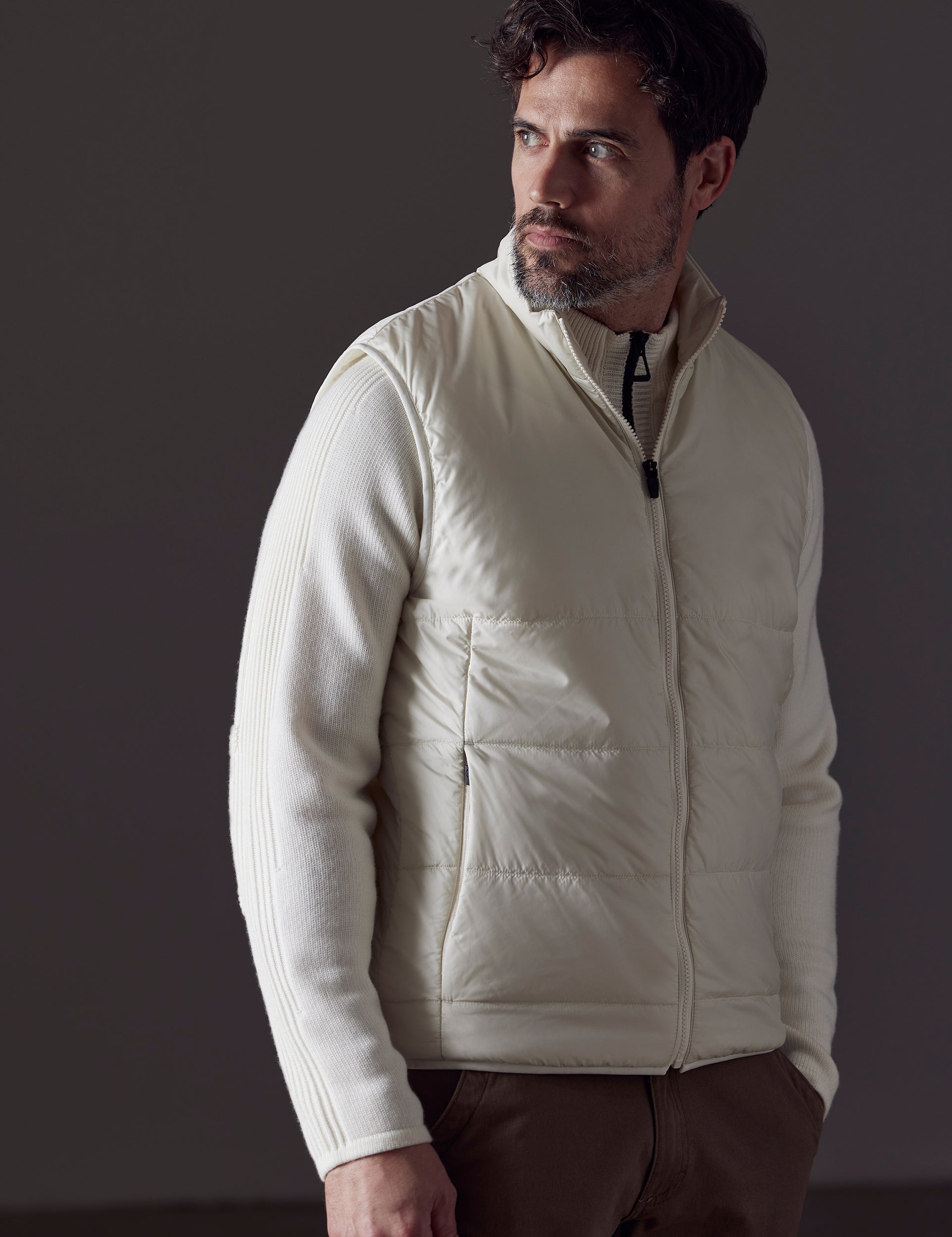 Front 3/4 body view of man wearing Eco Insulated Vest in Winter White from AETHER Apparel.