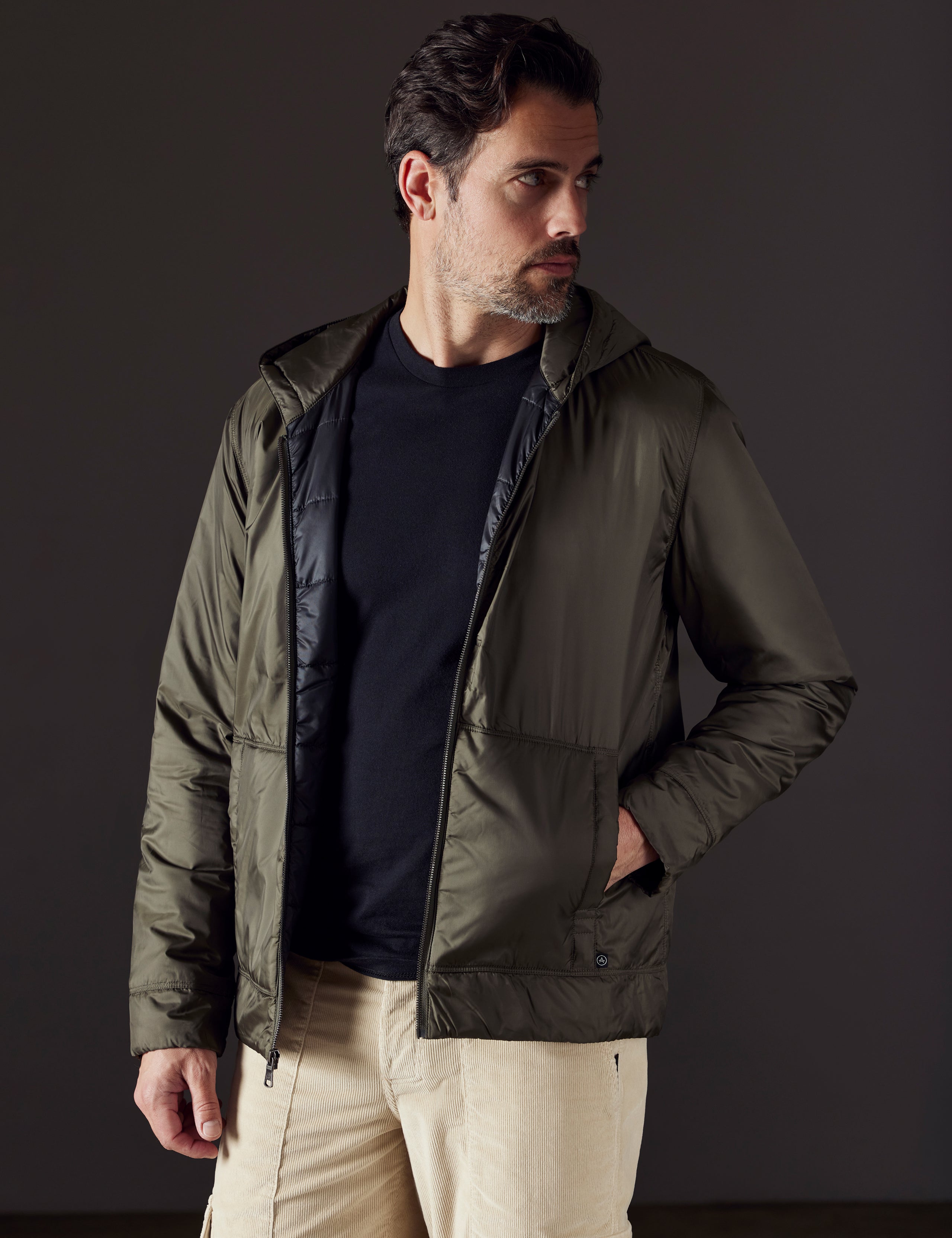 Front body view of man wearing Eco Space Hoodie in Hunter Green from AETHER Apparel.