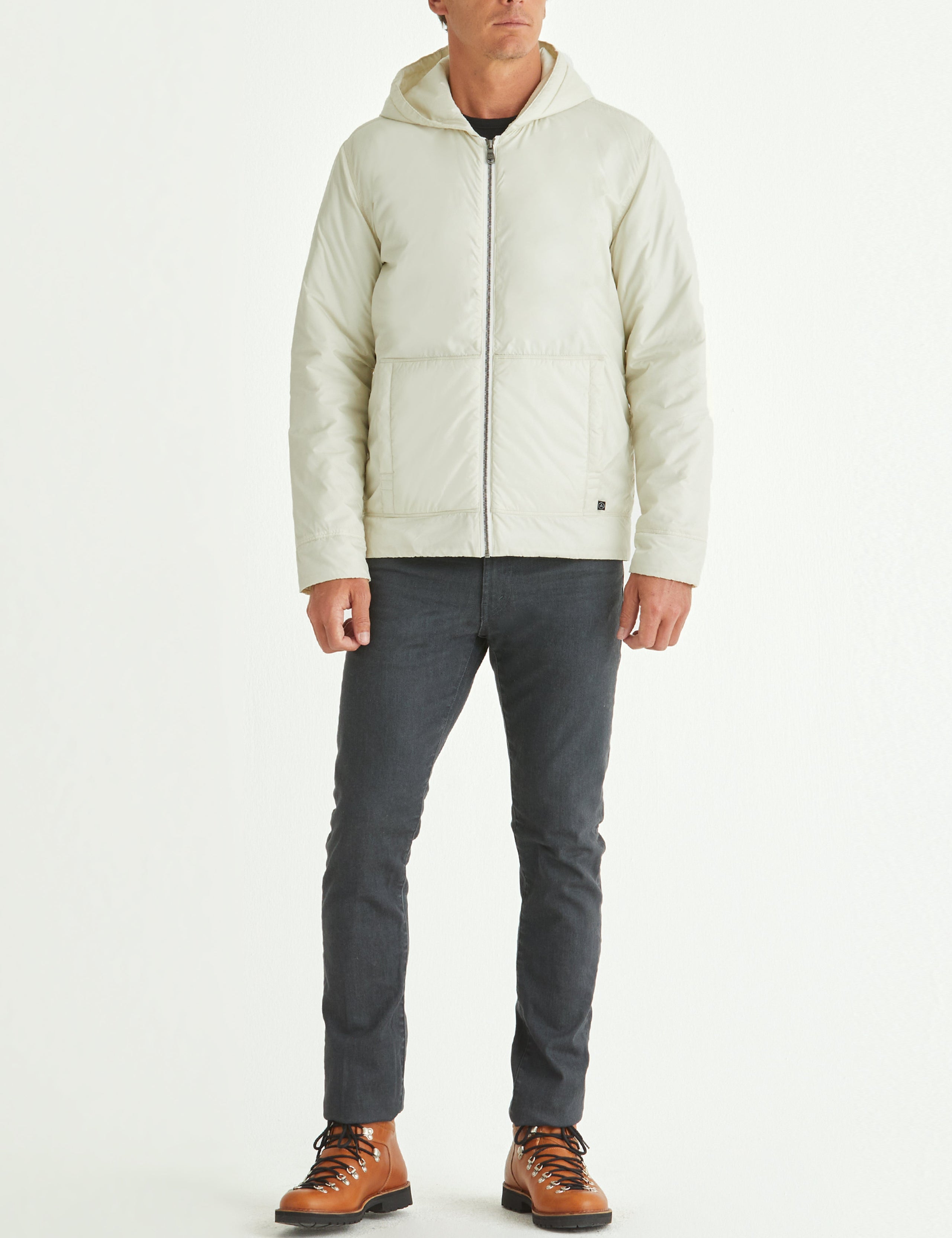 Front full-body view of man wearing Eco Space Hoodie in Winter White from AETHER Apparel.