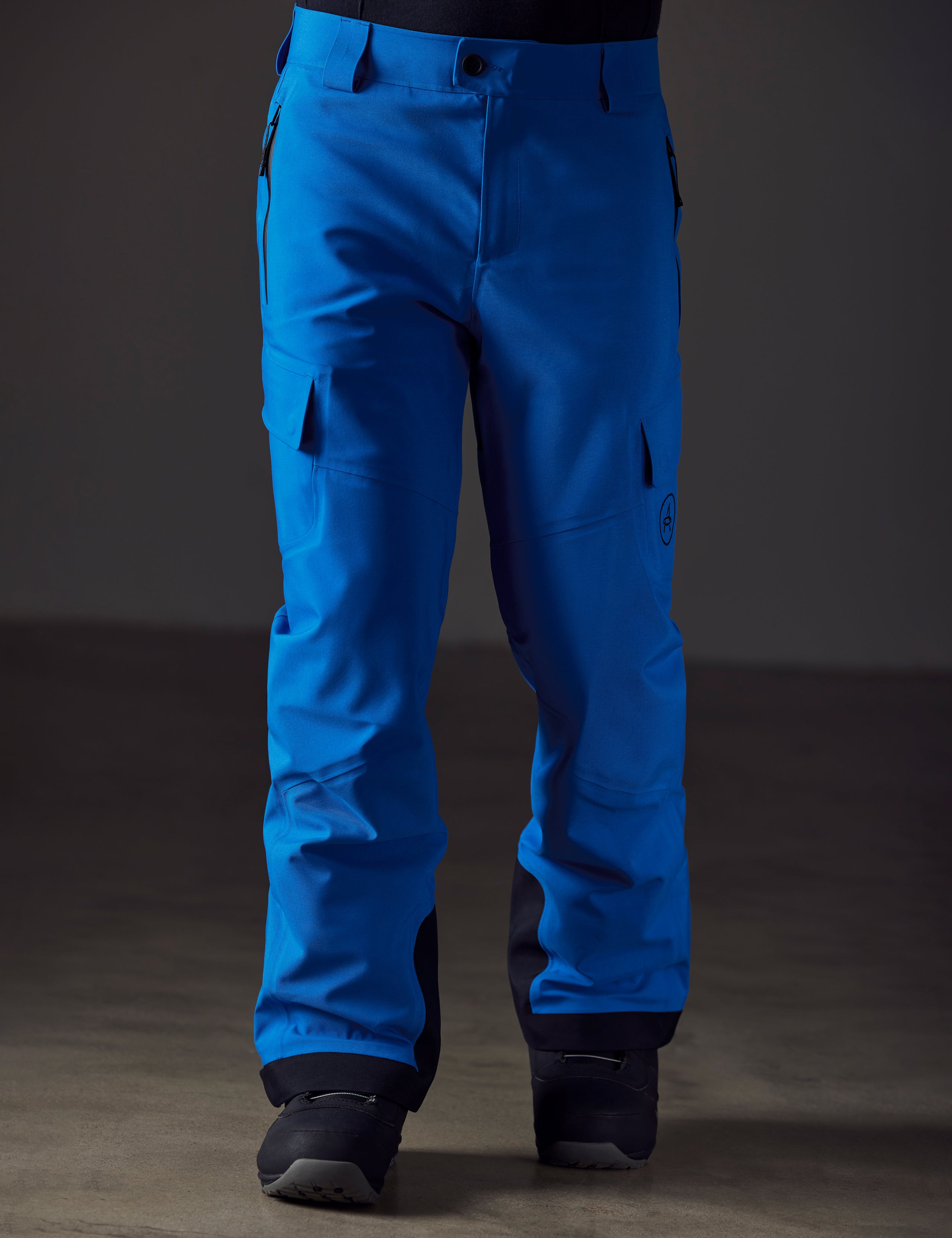 Front lower body view of man wearing Explorer Snow Pant in Summit Blue from AETHER Apparel.