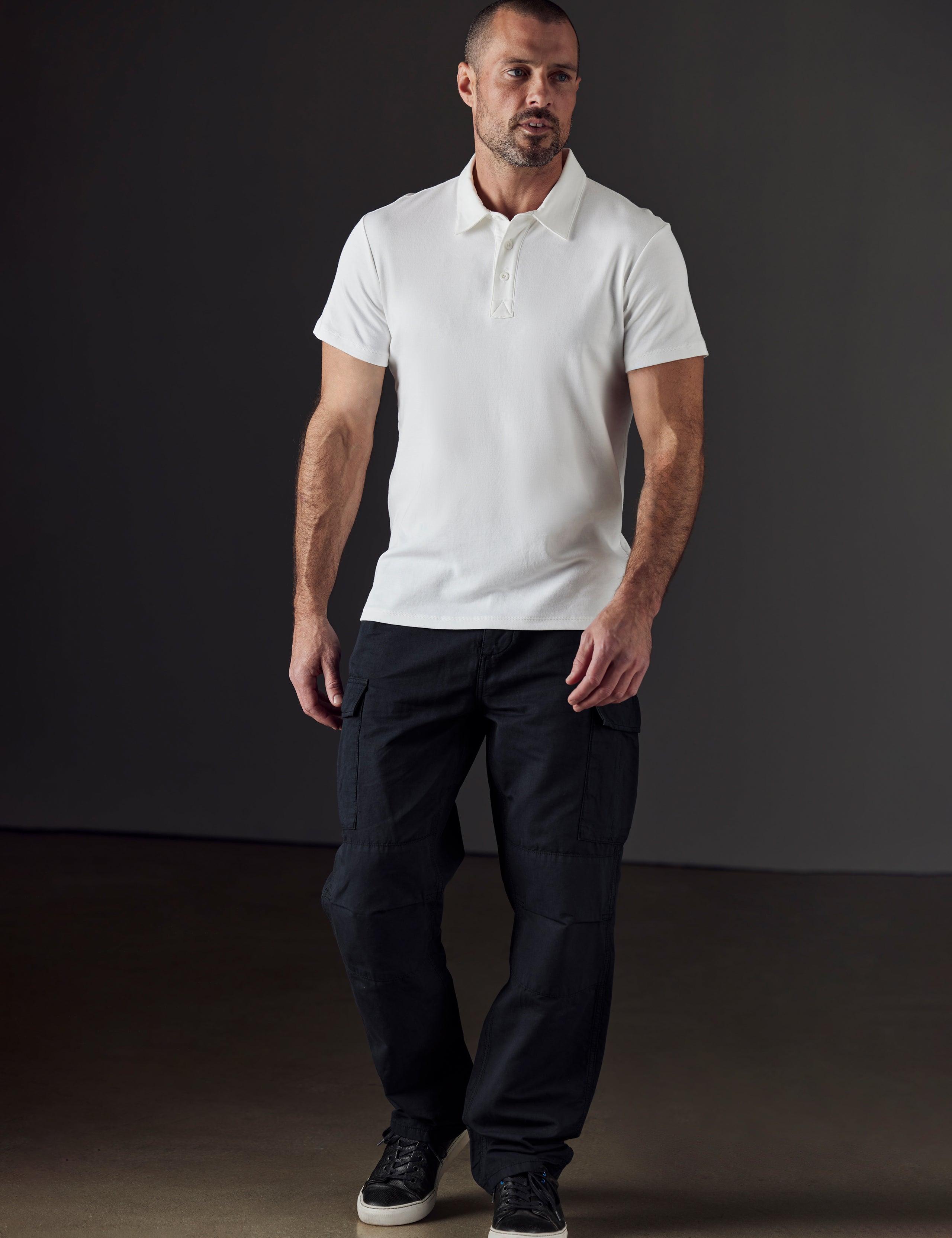 Front full-body view of man wearing Glade Fatigue Pant in Onyx Black from AETHER Apparel.
