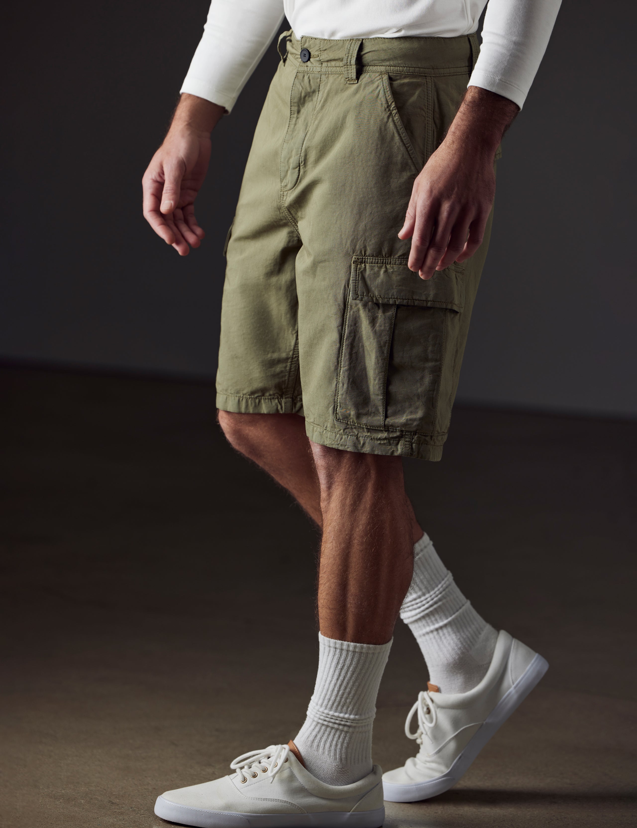Front 3/4 lower body view of man wearing Glade Fatigue Short in Fern Green from AETHER Apparel.
