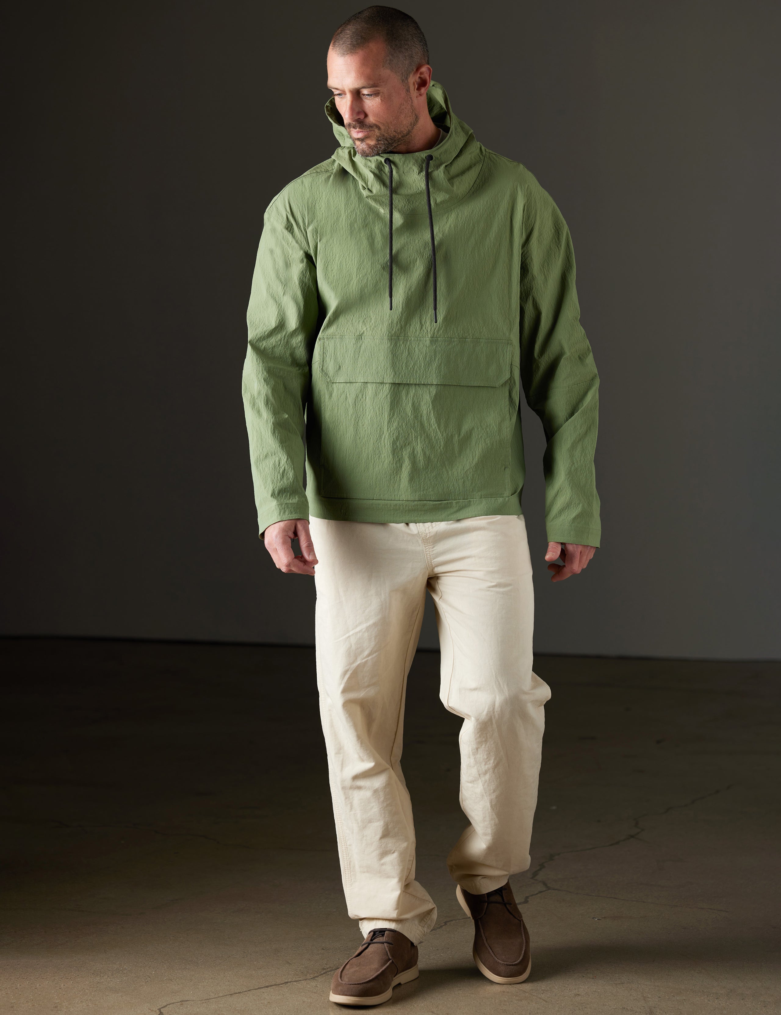 Front full-body view of man wearing Harrier Anorak in Mineral Green from AETHER Apparel.