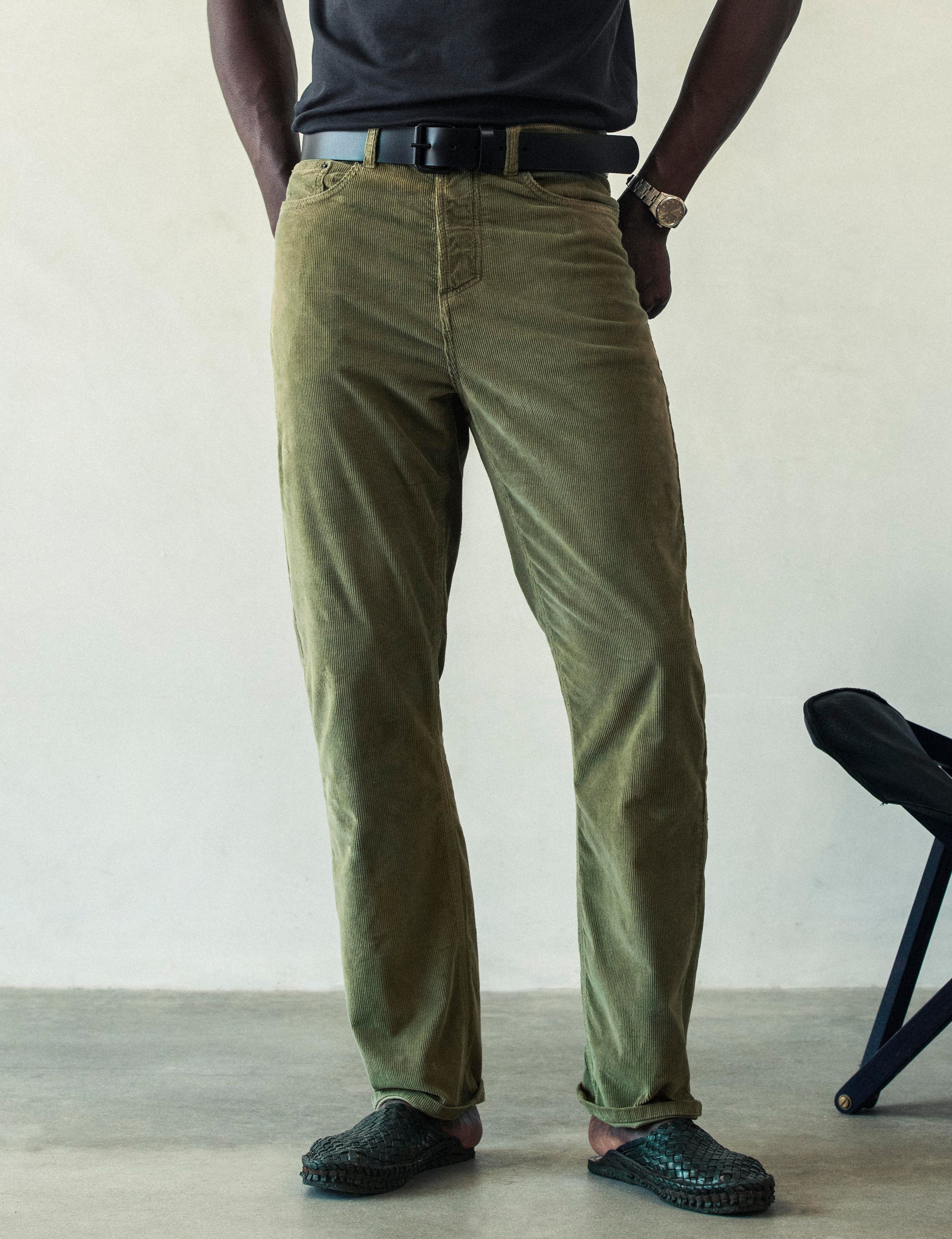Front lower body view of man wearing Hayden Corduroy Pant in Fern Green from AETHER Apparel.