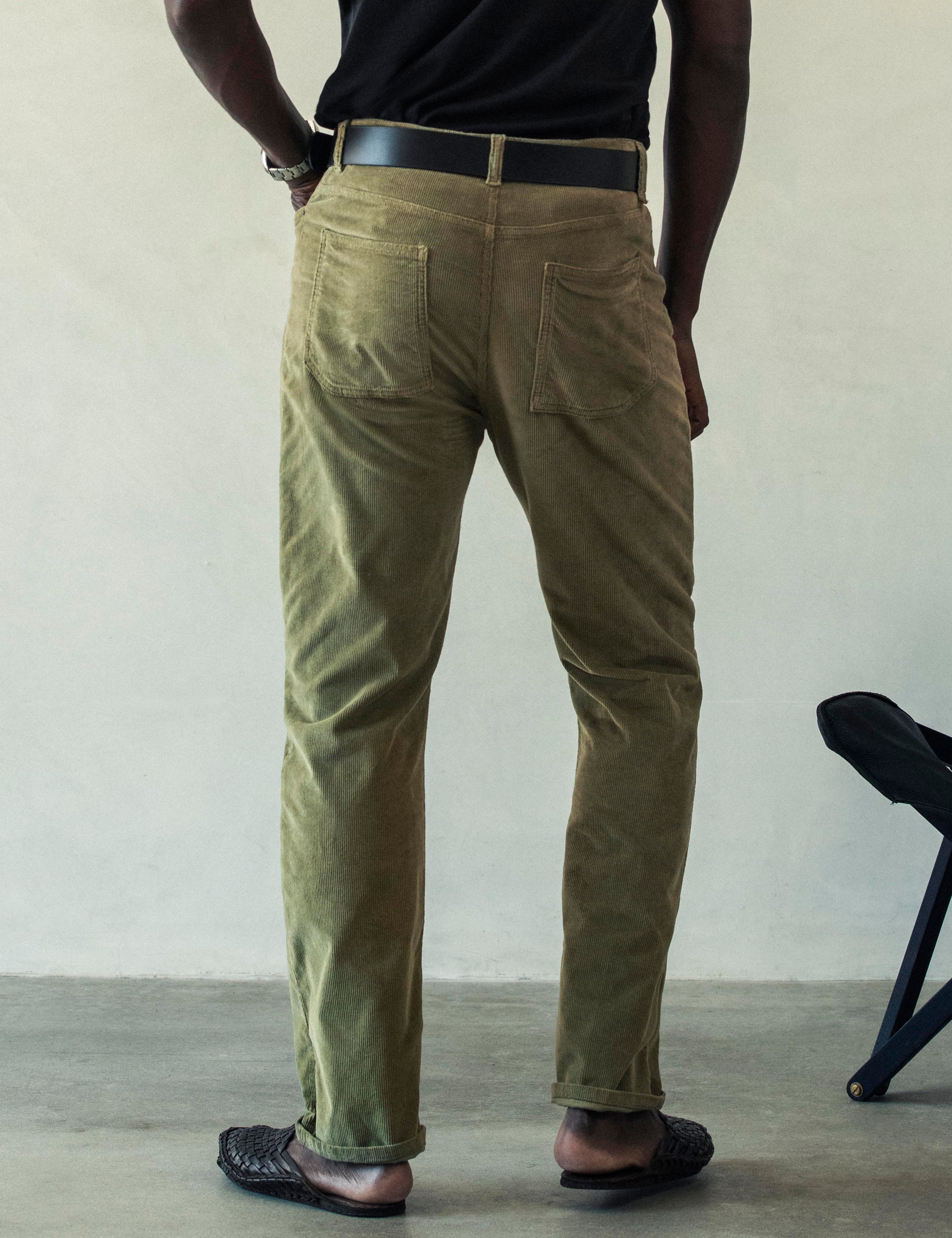 Rear lower body view of man wearing Hayden Corduroy Pant in Fern Green from AETHER Apparel.