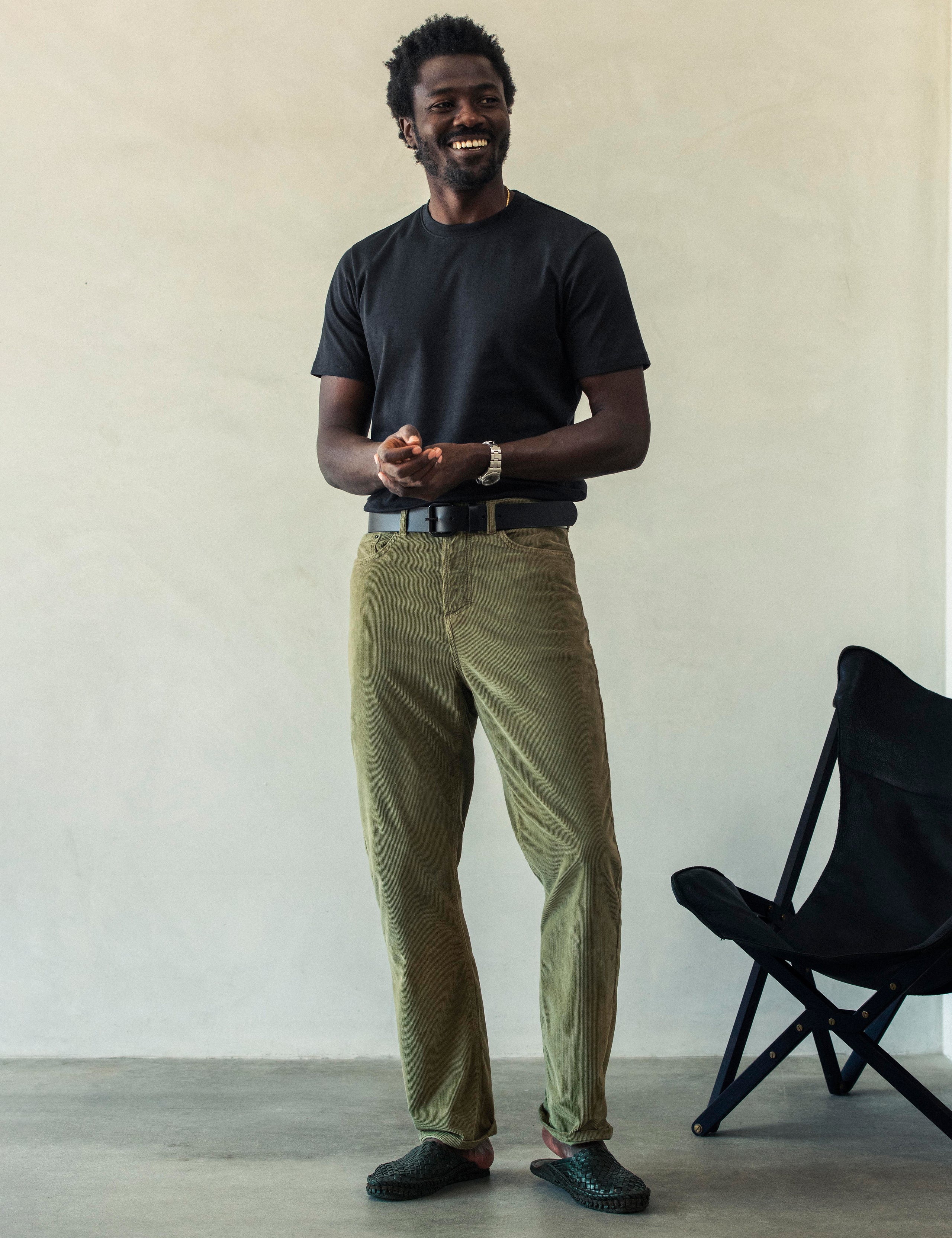 Front full-body view of man wearing Hayden Corduroy Pant in Fern Green from AETHER Apparel.