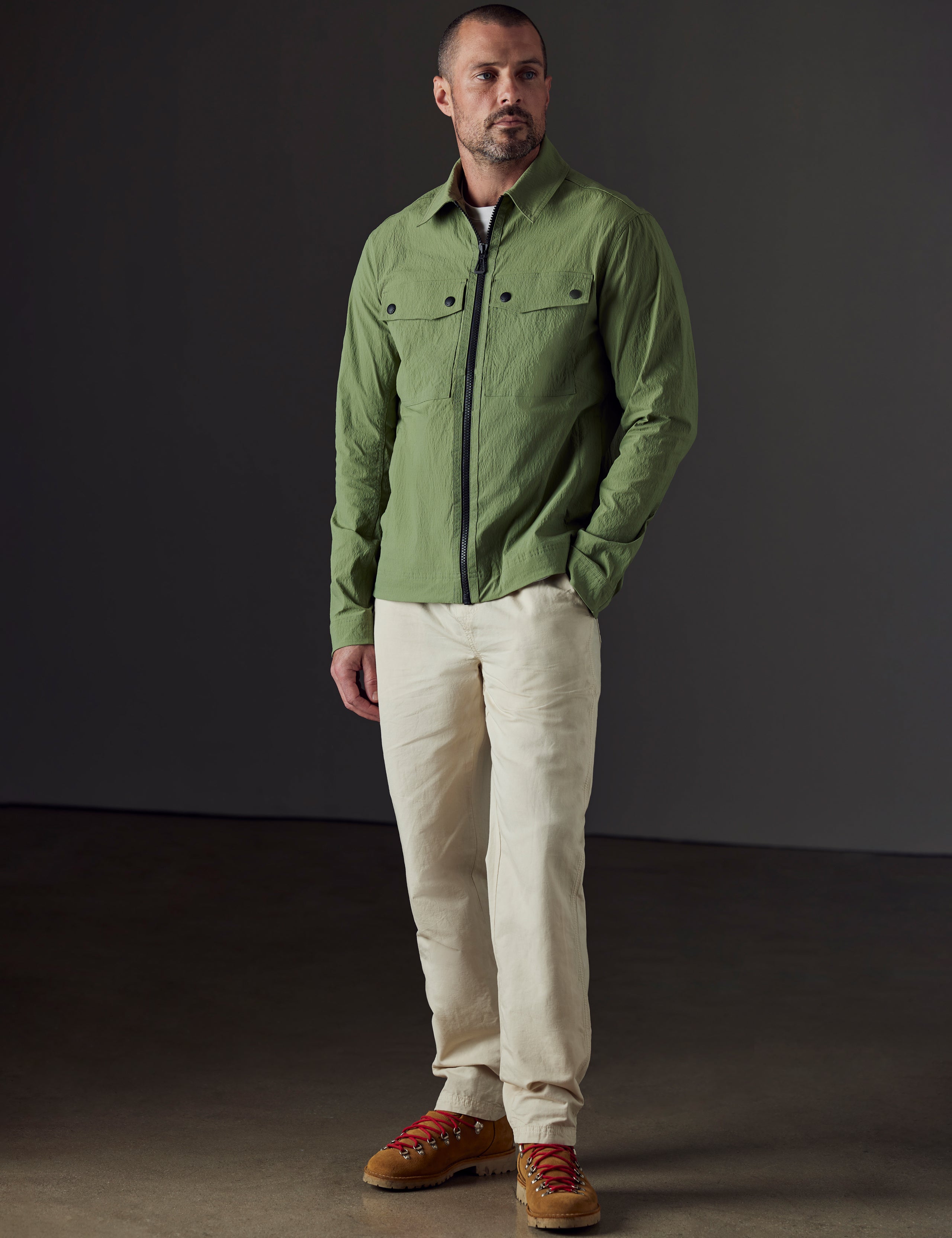 Front 3/4 full-body view of man wearing Highland Drawstring Pant in Bone White from AETHER Apparel.