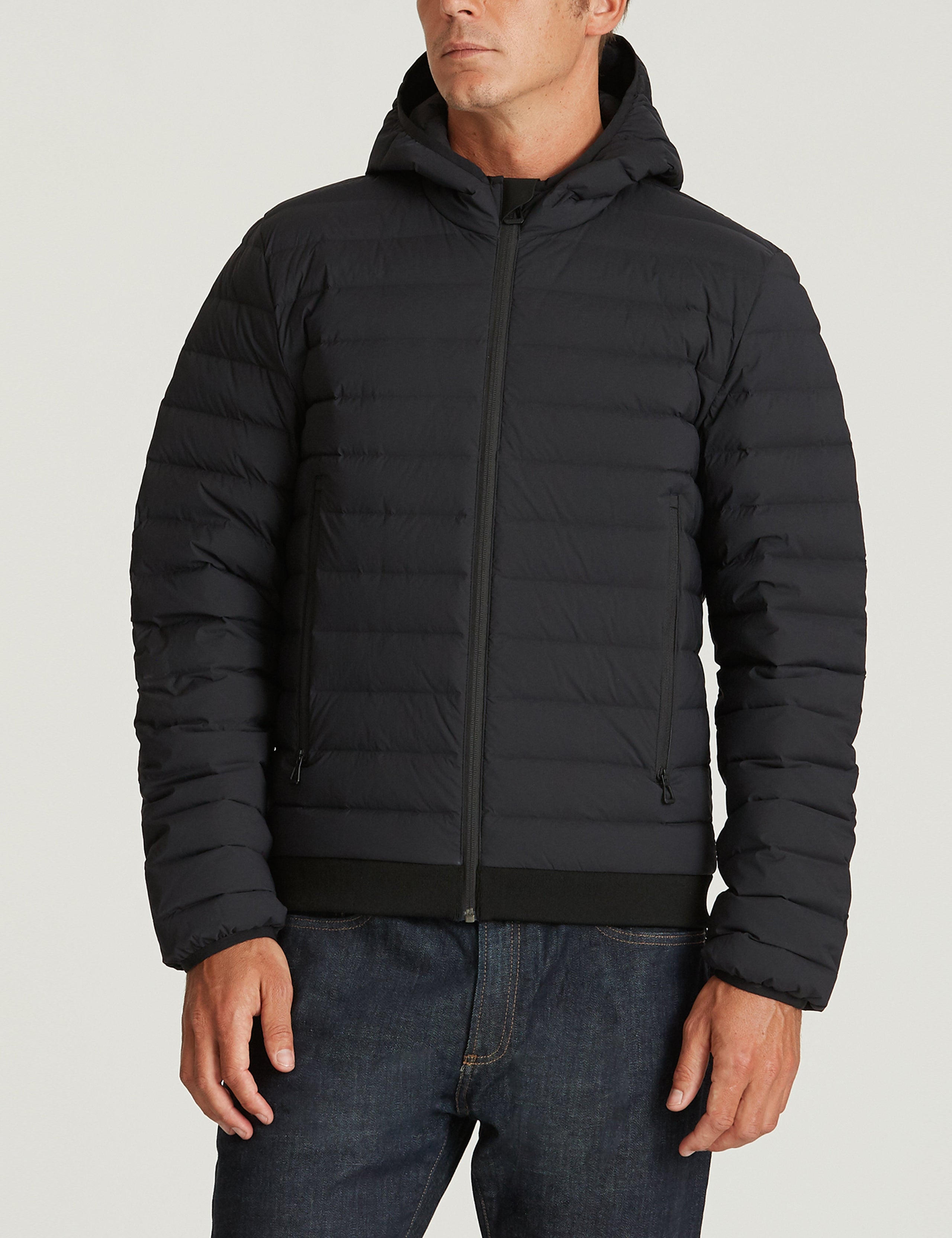 Front body view of man wearing Launch Jacket in Onyx Black from AETHER Apparel.