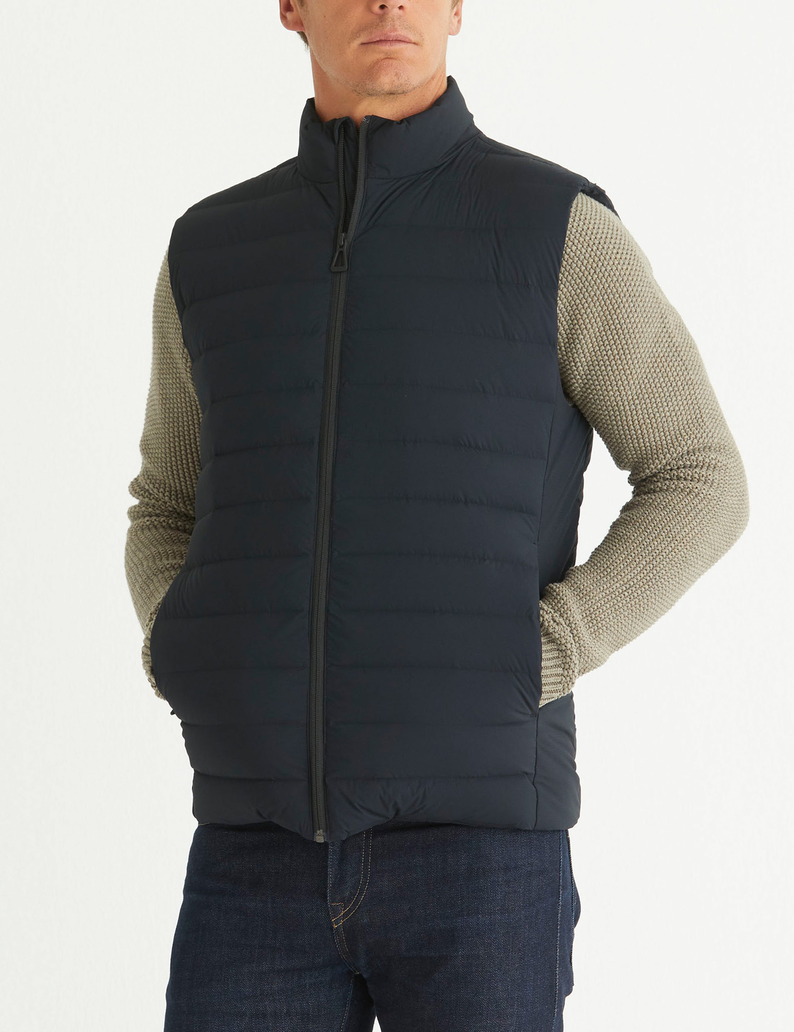 Front 3/4 body view of man wearing Launch Vest in Onyx Black from AETHER Apparel.