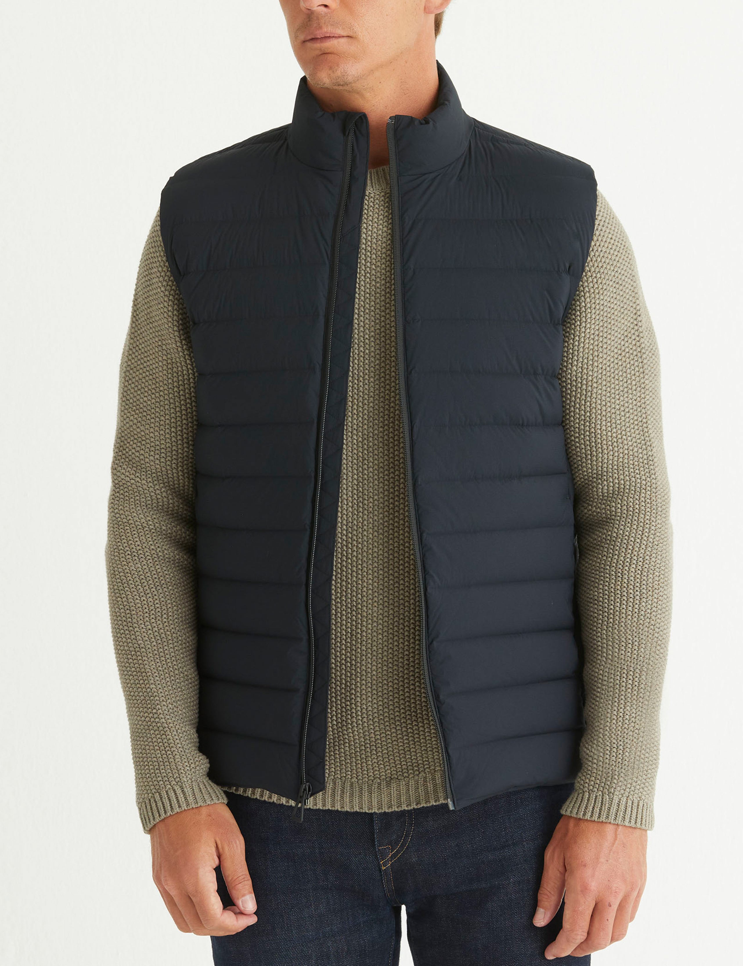 Front body view of man wearing Launch Vest in Onyx Black from AETHER Apparel.