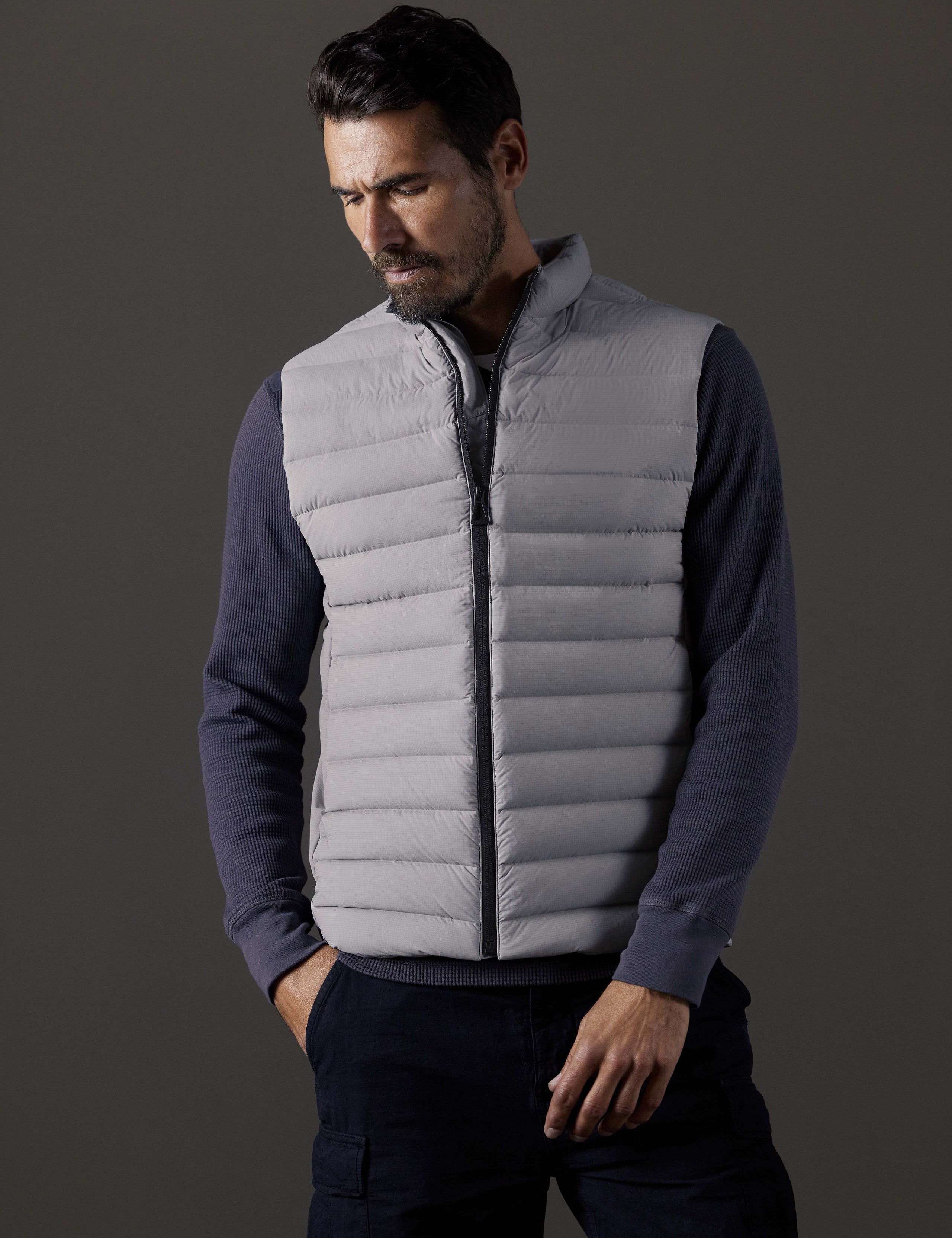 Front body view of man wearing Launch Vest in Sky Grey from AETHER Apparel.