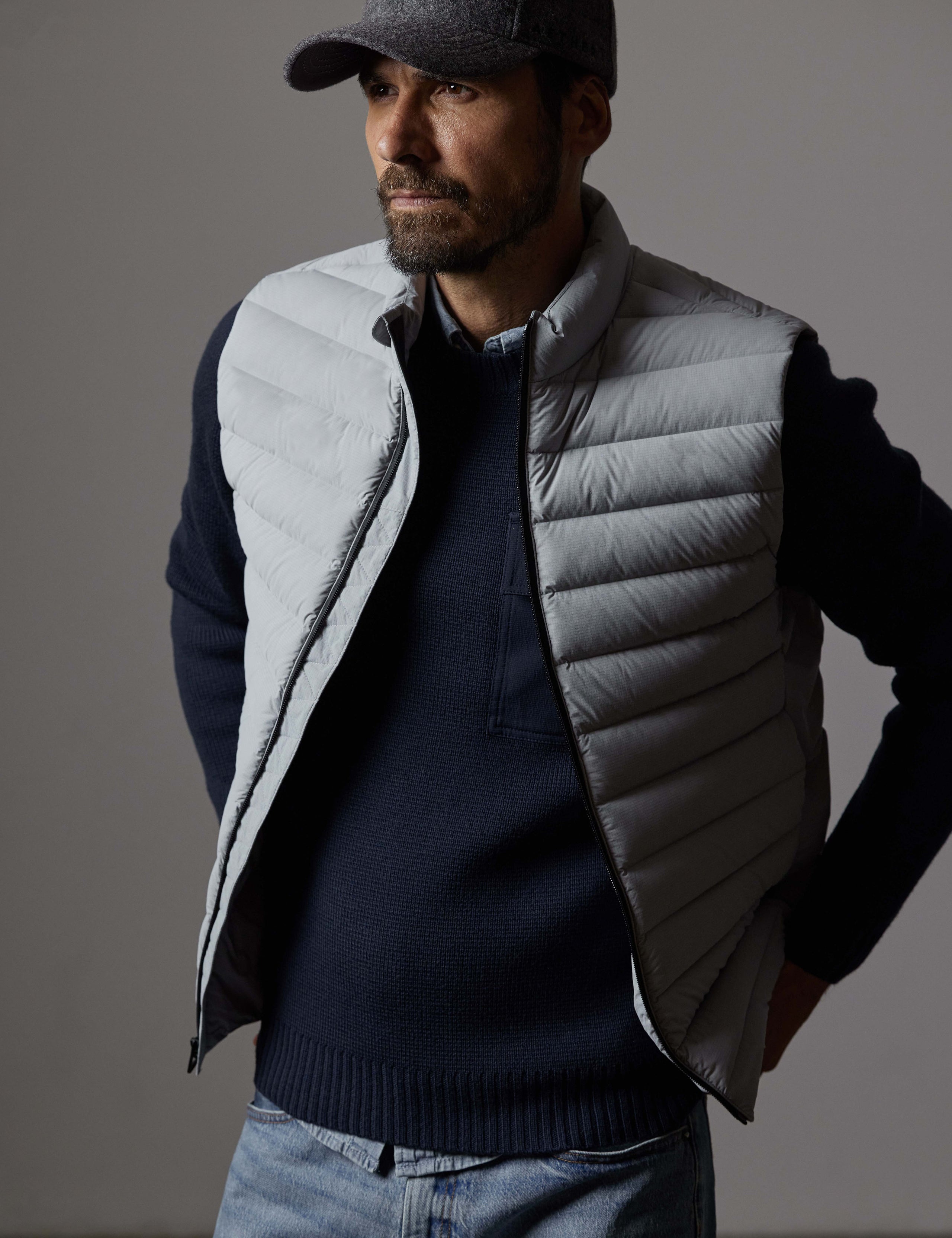 Front 3/4 body view of man wearing Launch Vest in Sky Grey from AETHER Apparel.