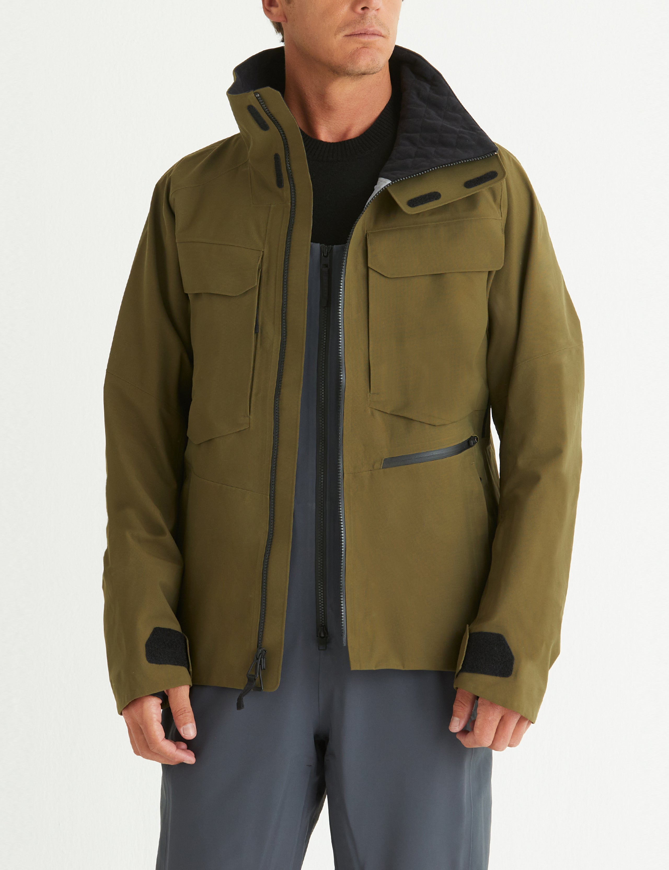 Front body view of man wearing Mission Snow Shell in Command Green from AETHER Apparel.