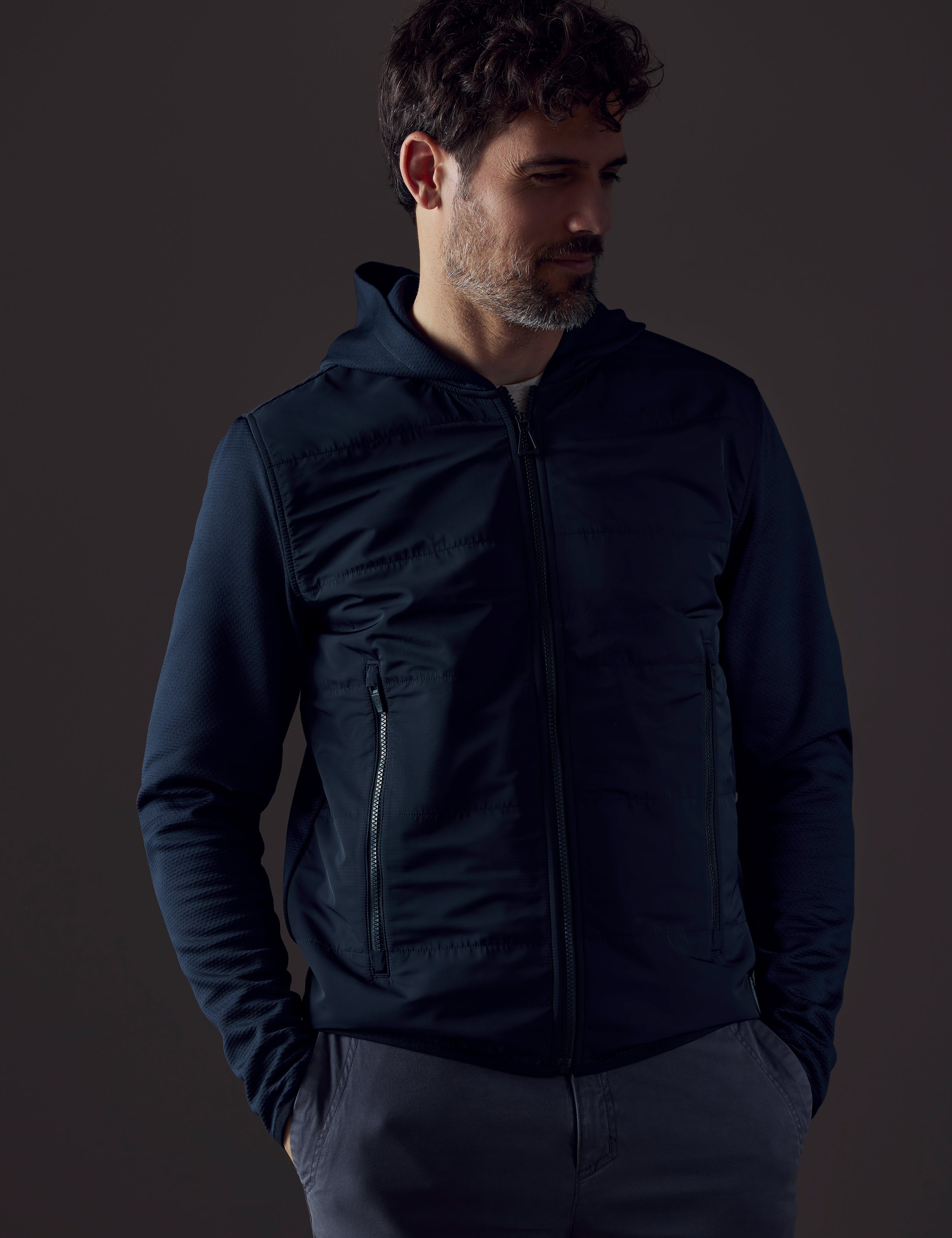 Front body view of man wearing Morgan Technical Hoodie in Total Eclipse dark blue from AETHER Apparel.