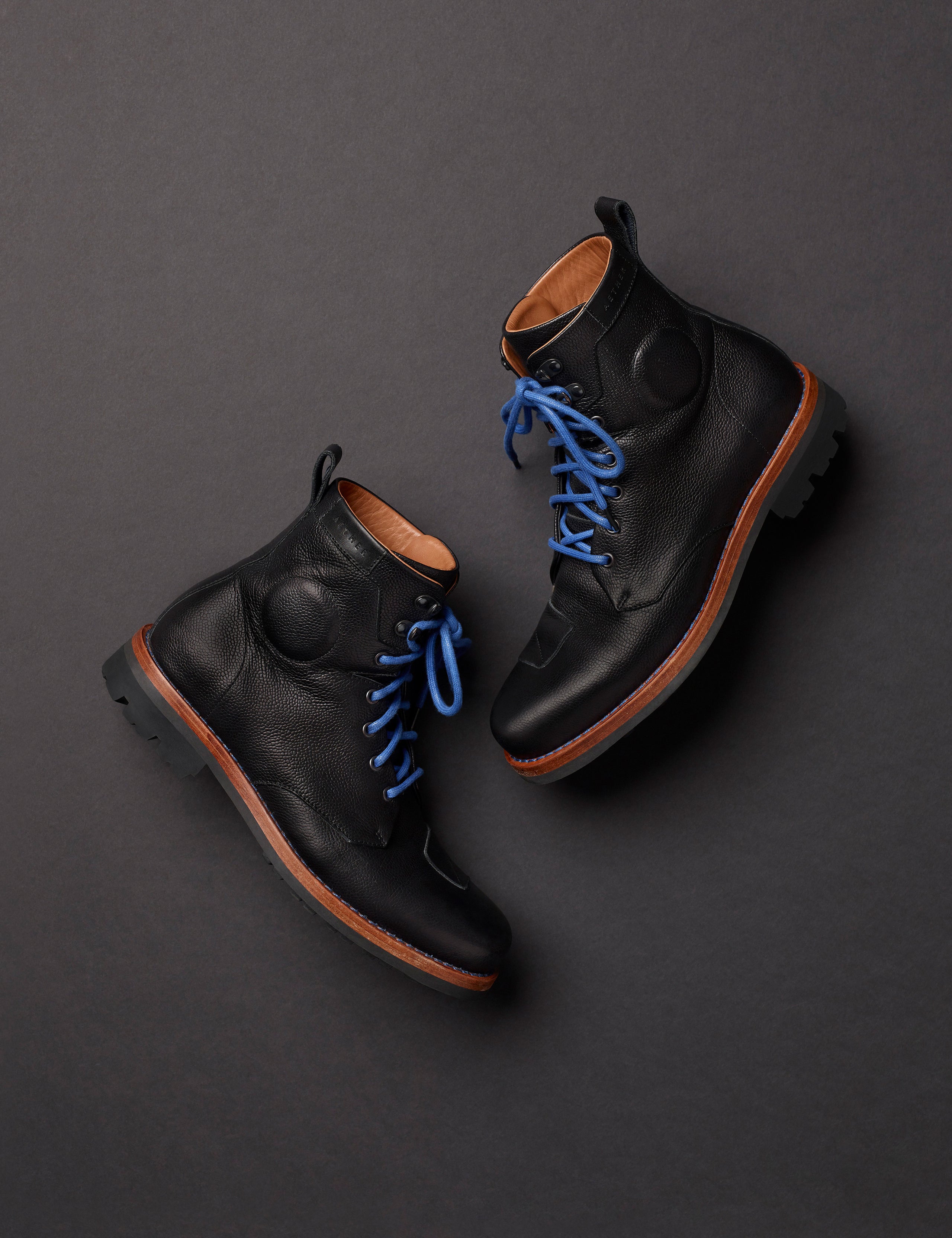 Flat lay of AETHER Moto Boot in Jet Black from AETHER Apparel.