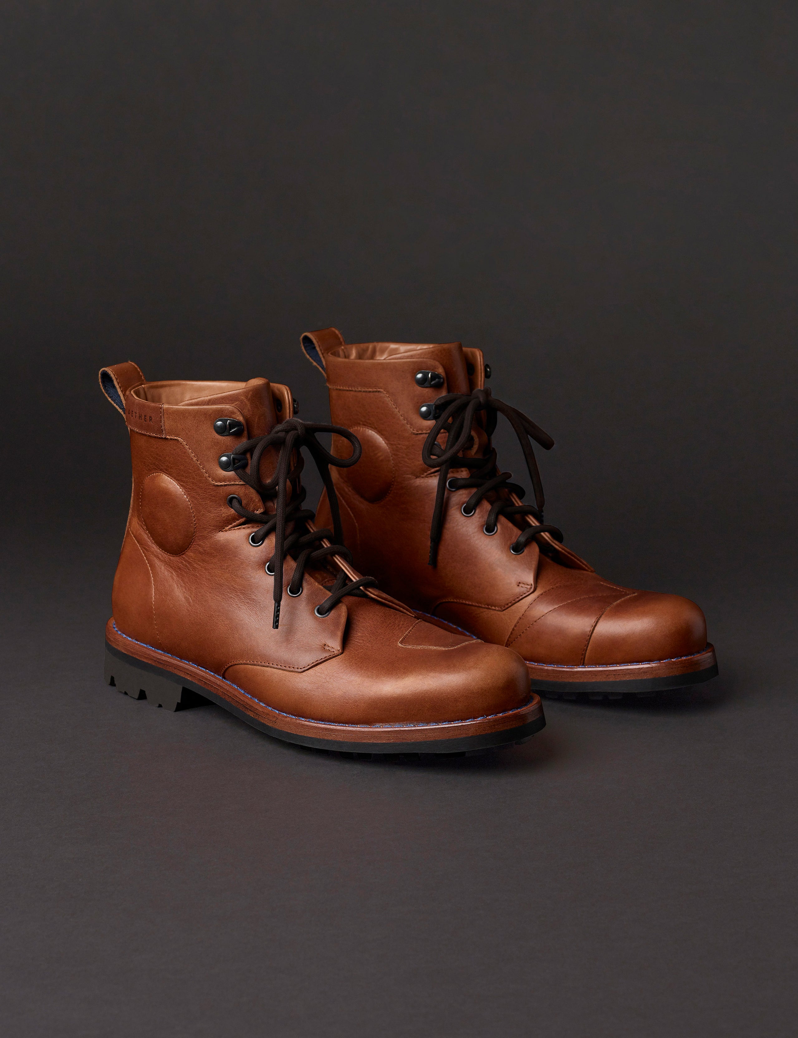 Front angled view of AETHER Moto Boot in Tan with black laces from AETHER Apparel.