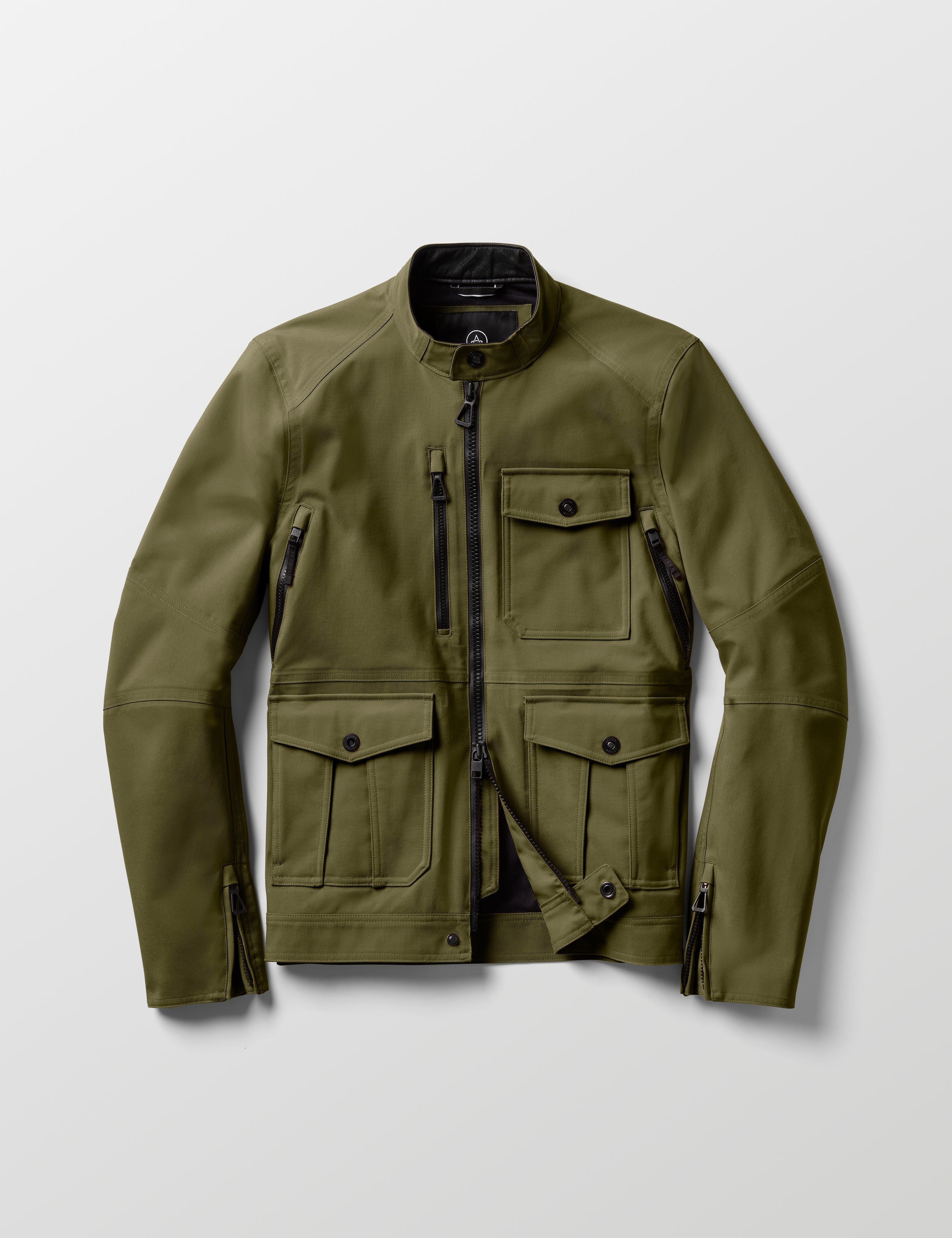 Flat lay of Mulholland Motorcycle Jacket in Command Green from AETHER Apparel.