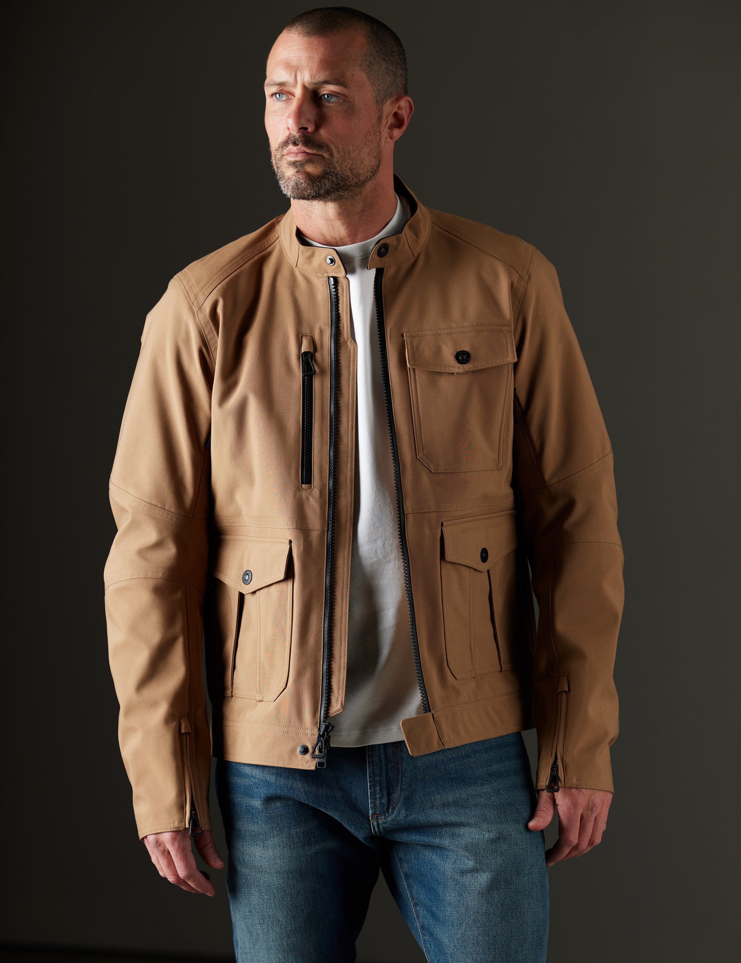 Front body view of man wearing Mulholland Motorcycle Jacket in Reverse Brown from AETHER Apparel.