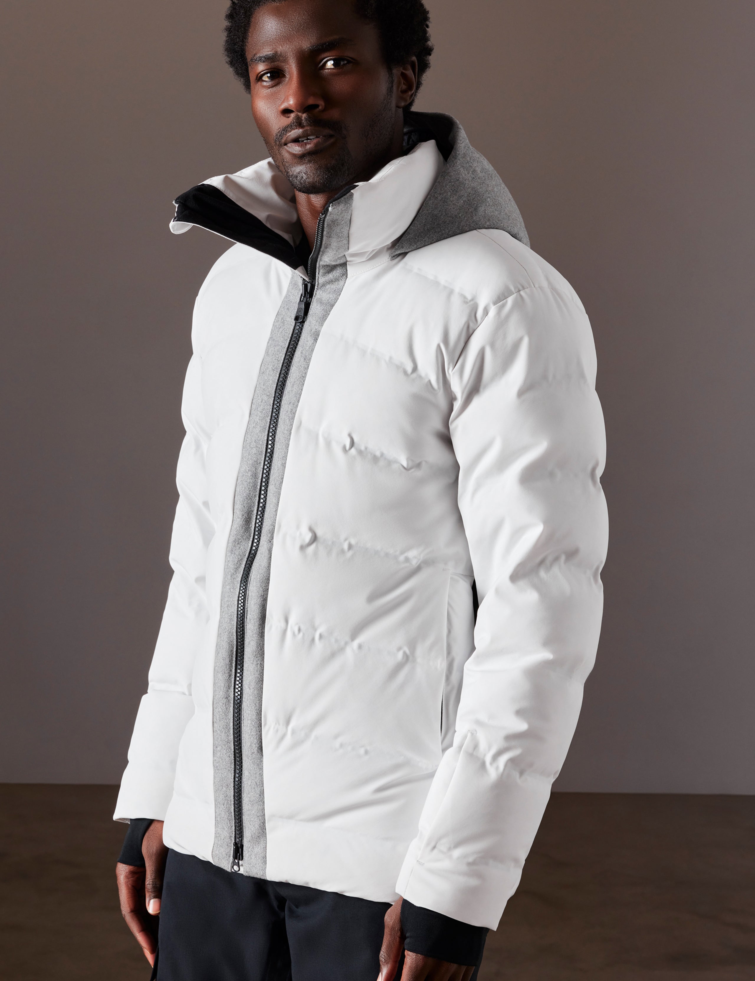 Front 3/4 body view of man wearing Nordic Jacket in White from AETHER Apparel.