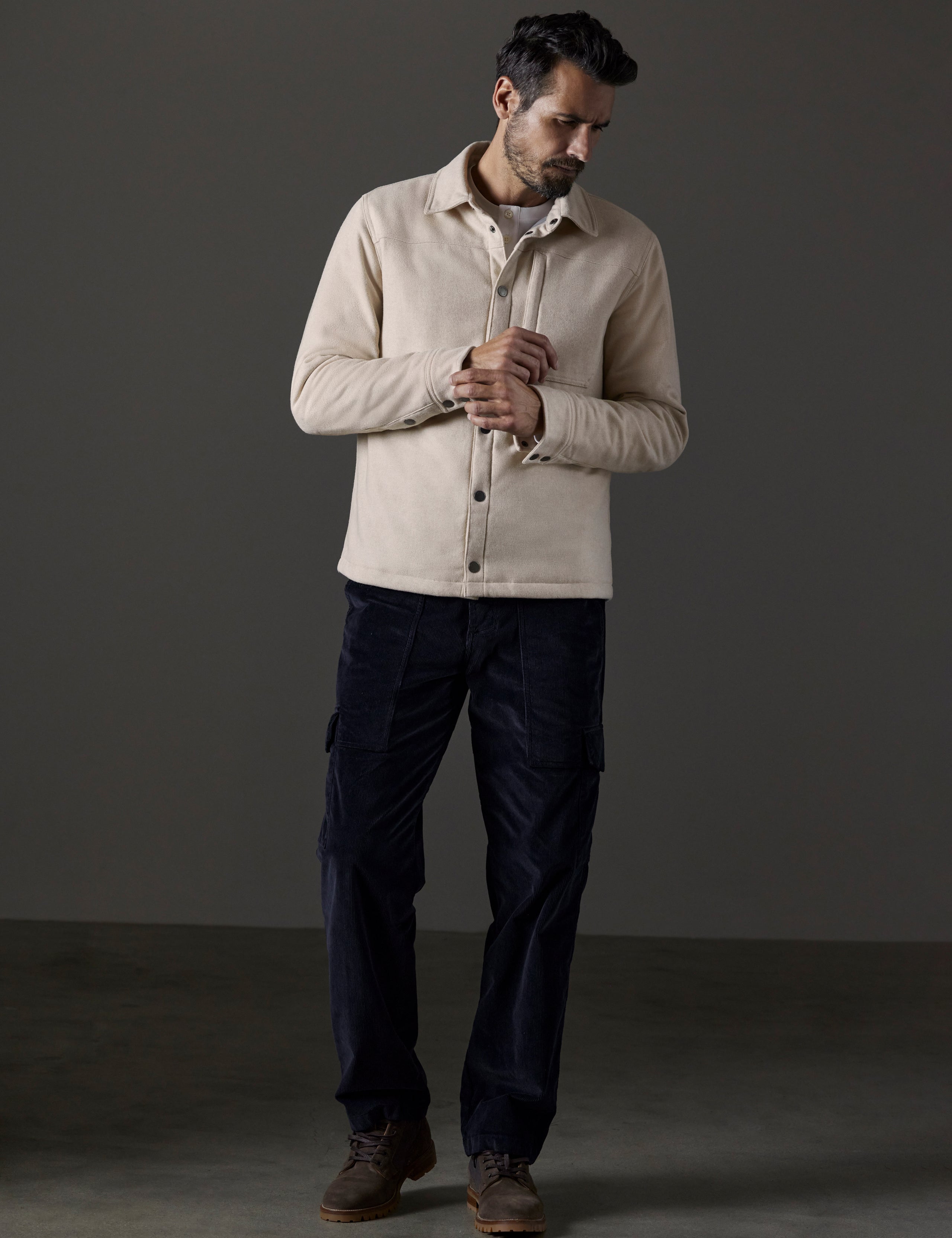 Front full-body view of man wearing Nova Insulated Button-Down in Bone Heather white from AETHER Apparel.