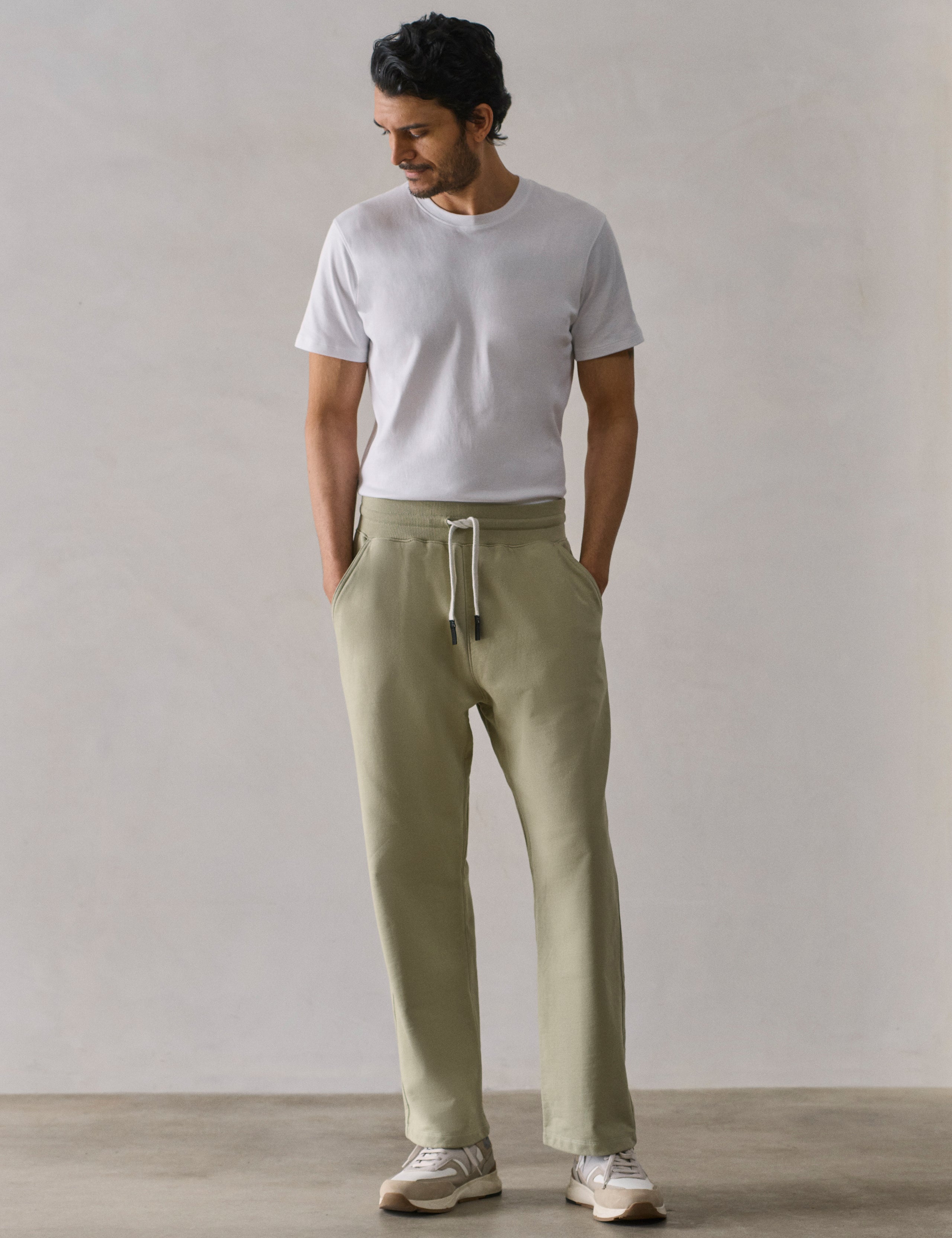 Front full-body view of man wearing Osa Easy-Fit Sweatpant in Sage Green from AETHER Apparel.