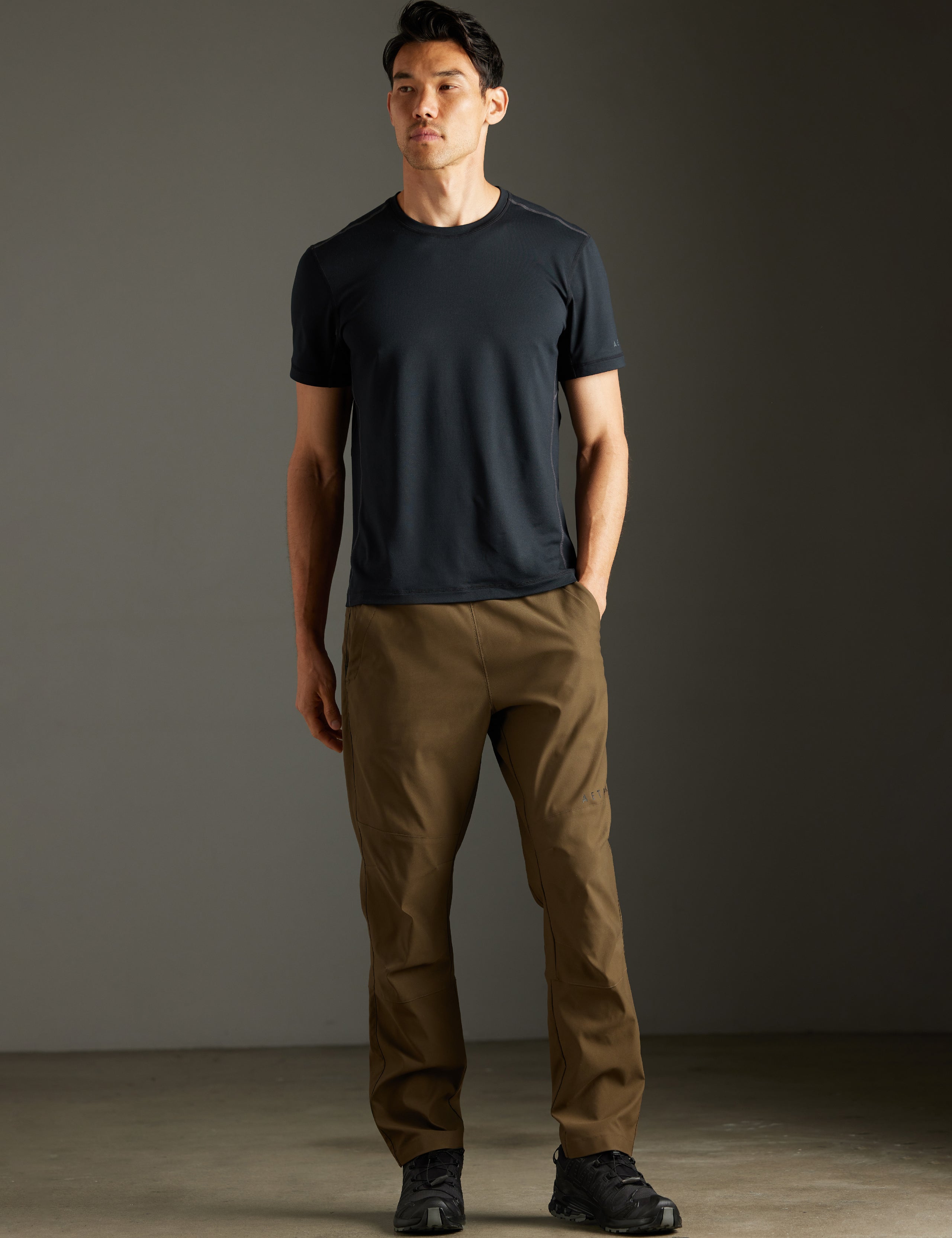 Front full-body view of man wearing Perth Pant in Cadet Green from AETHER Apparel.