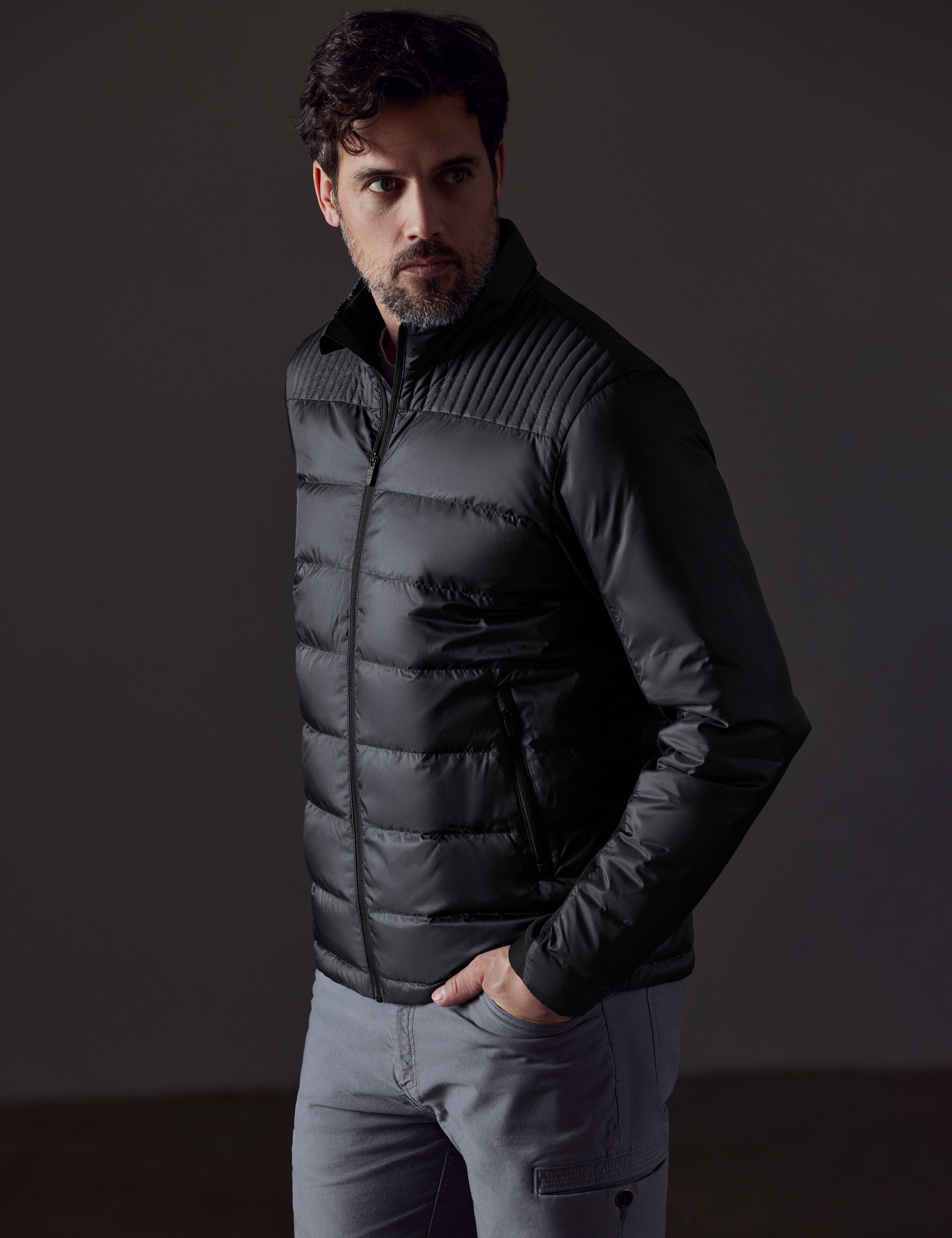 Front 3/4 body view of man wearing Phantom Jacket in Onyx Black from AETHER Apparel.