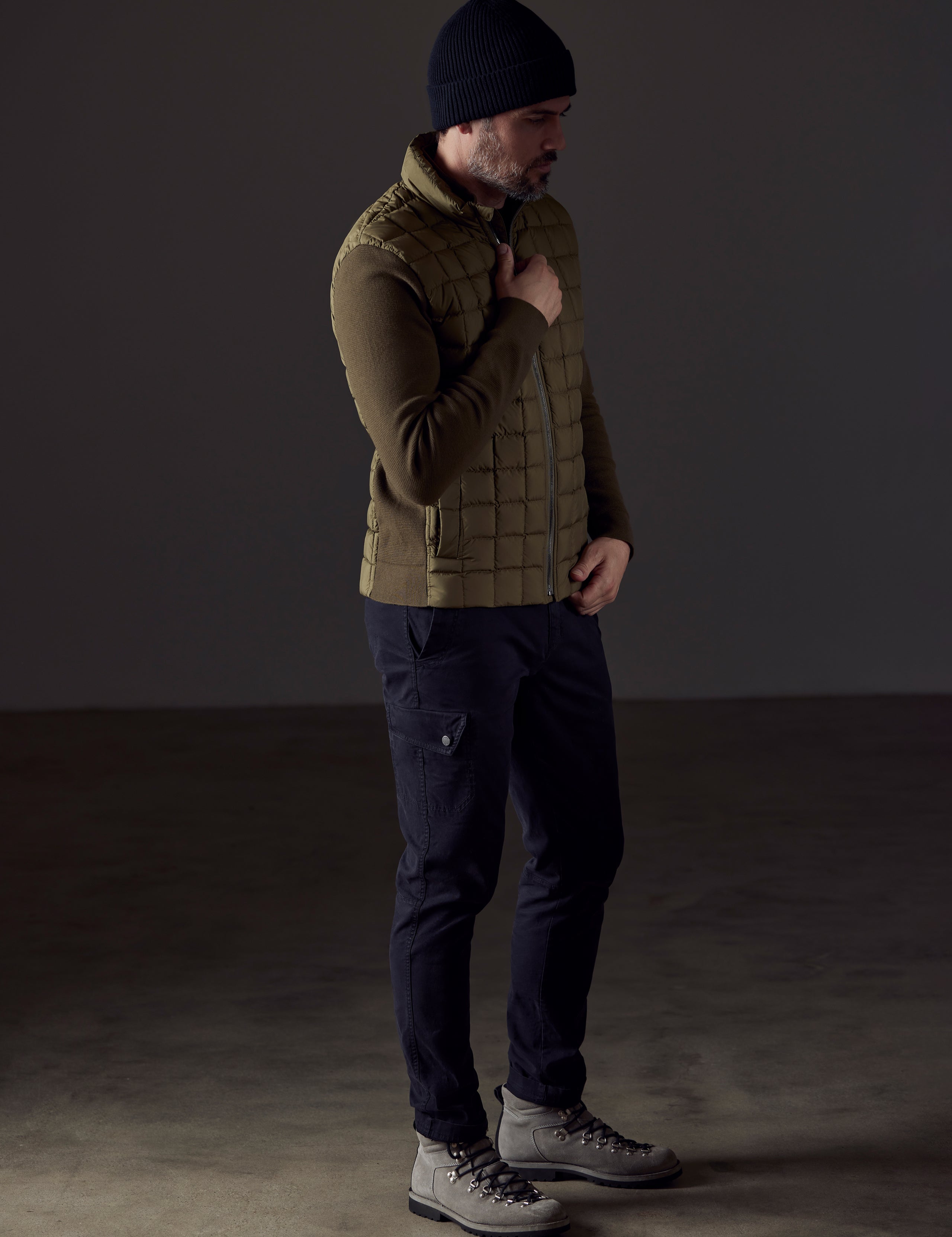 Front 3/4 full-body view of man wearing Phase Full-Zip in Command Green from AETHER Apparel.