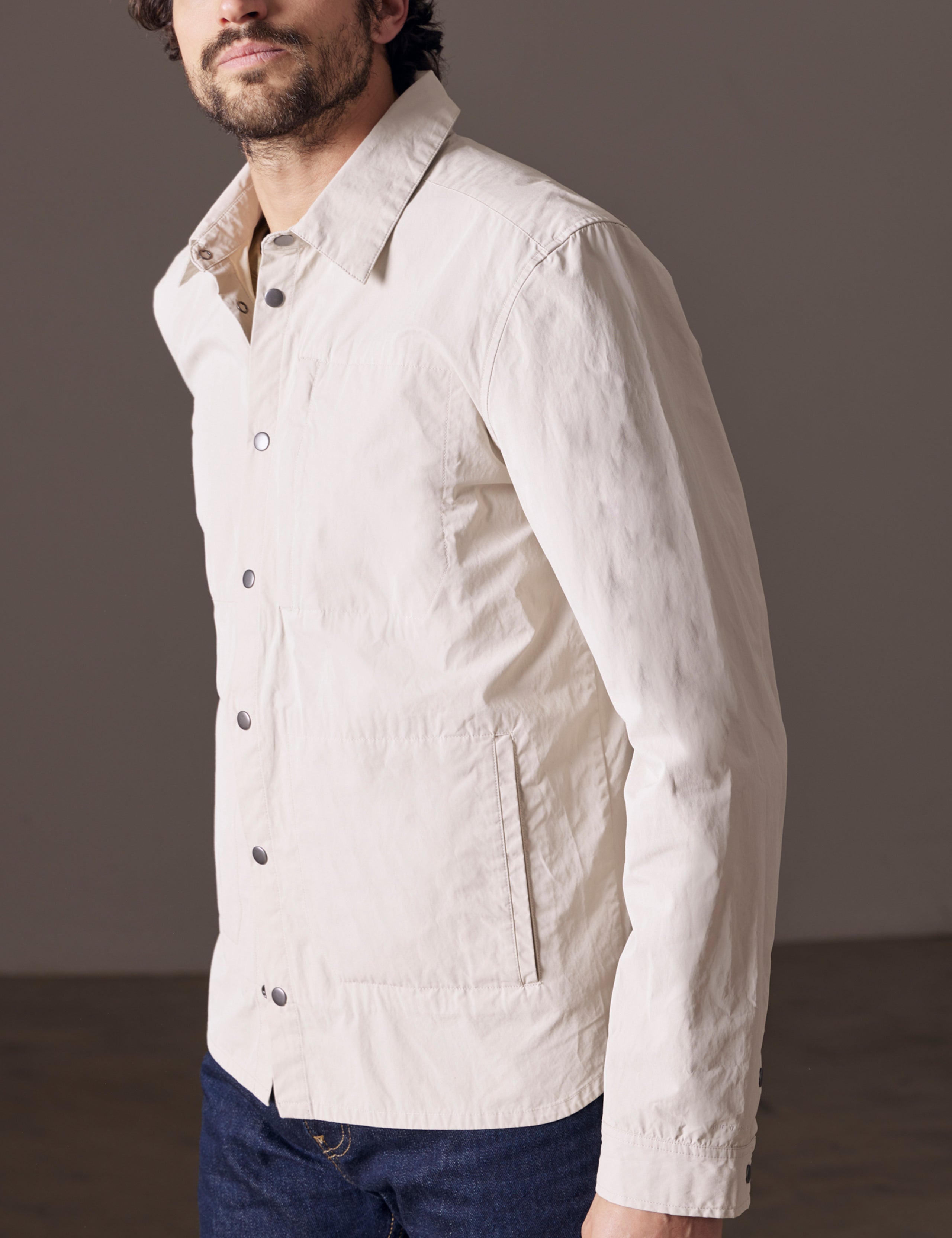 Front 3/4 body view of man wearing Pine Shacket in Bone white from AETHER Apparel.