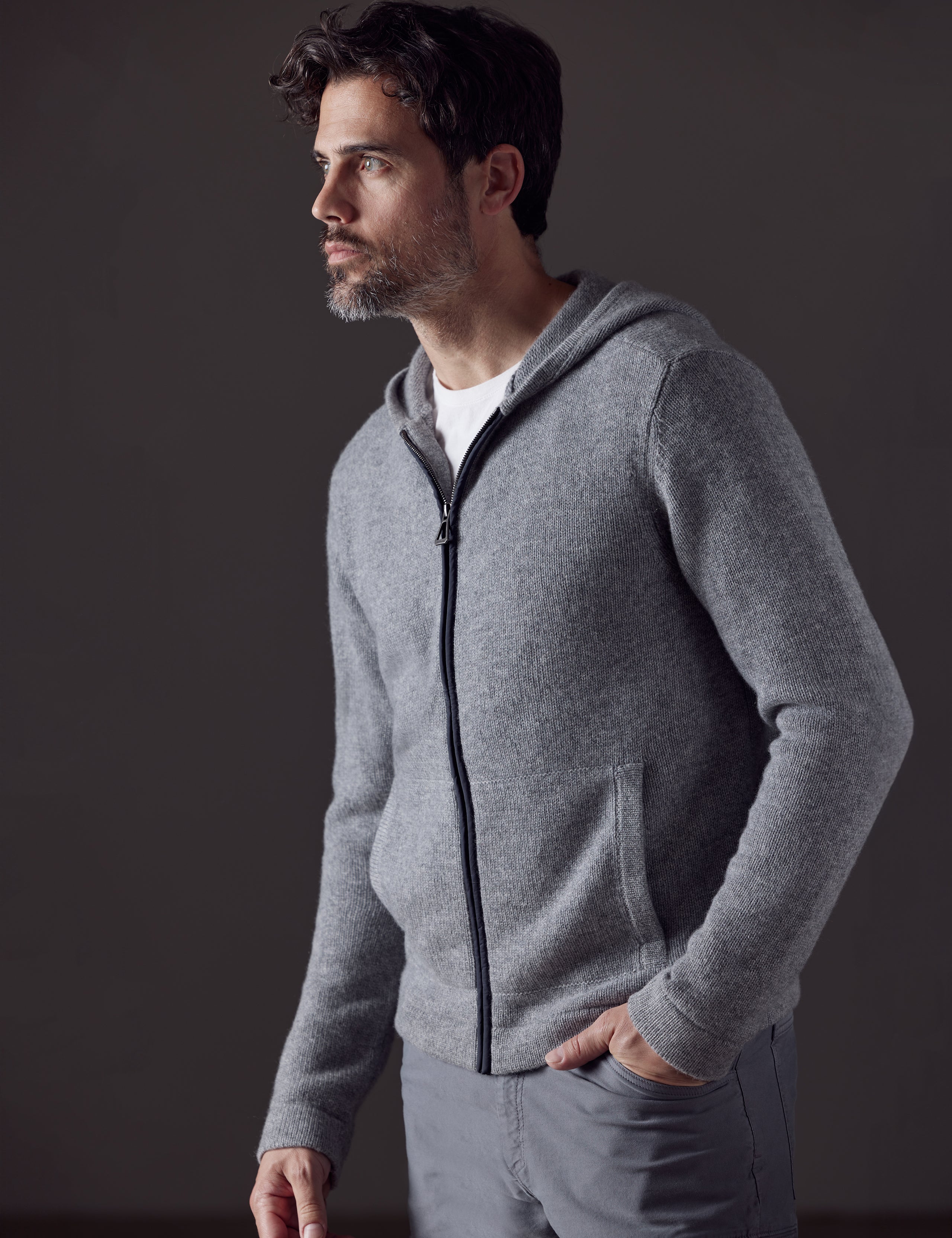 Front 3/4 body view of man wearing Sawyer Cashmere Full-Zip in Heather Grey from AETHER Apparel.
