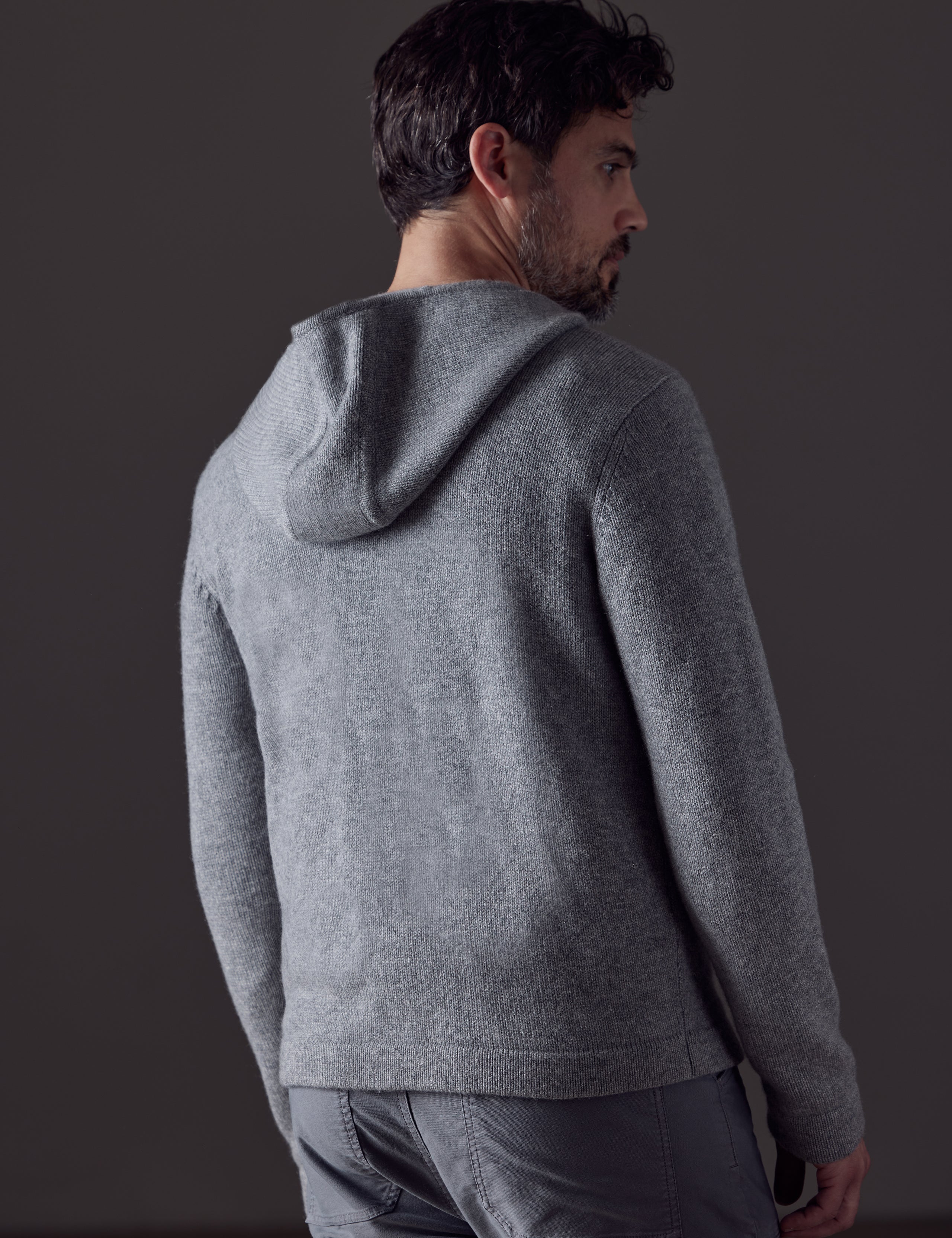Rear 3/4 body view of man wearing Sawyer Cashmere Full-Zip in Heather Grey from AETHER Apparel.