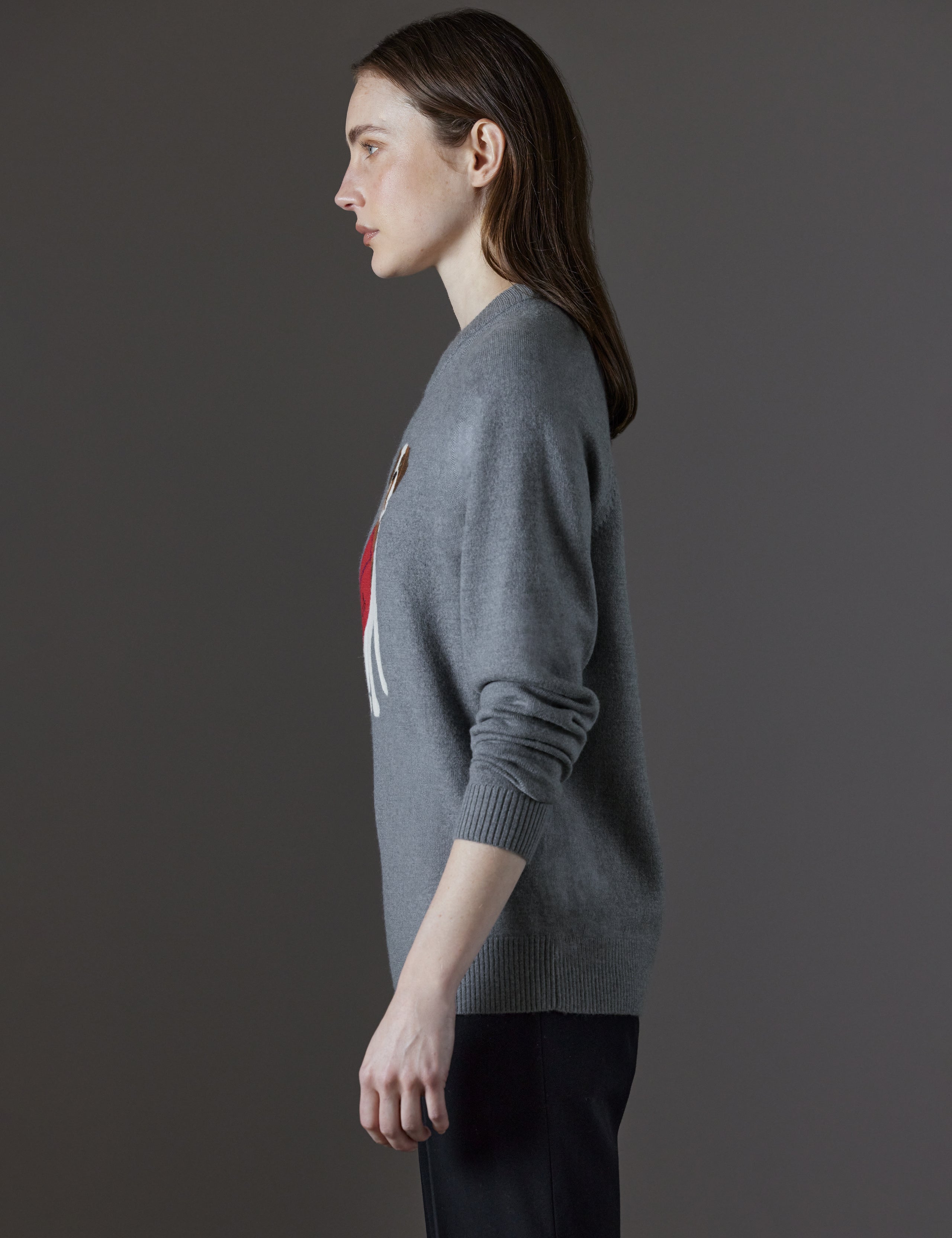Side profile view of woman wearing Mosie Sweater in Light Heather Grey from AETHER Apparel.