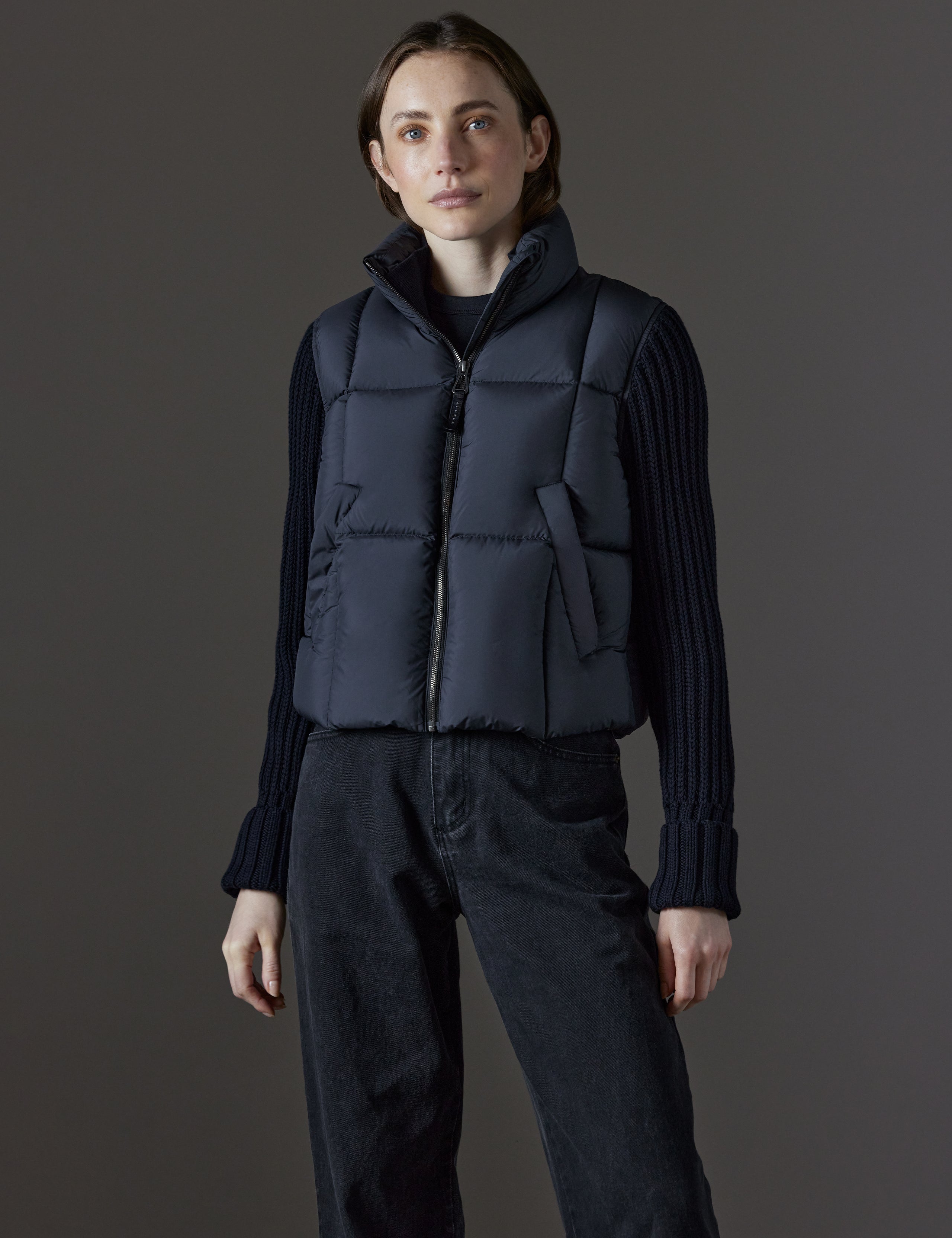 Front view of woman wearing Nina Cardigan-Sleeve Jacket in Onyx Black from AETHER Apparel.
