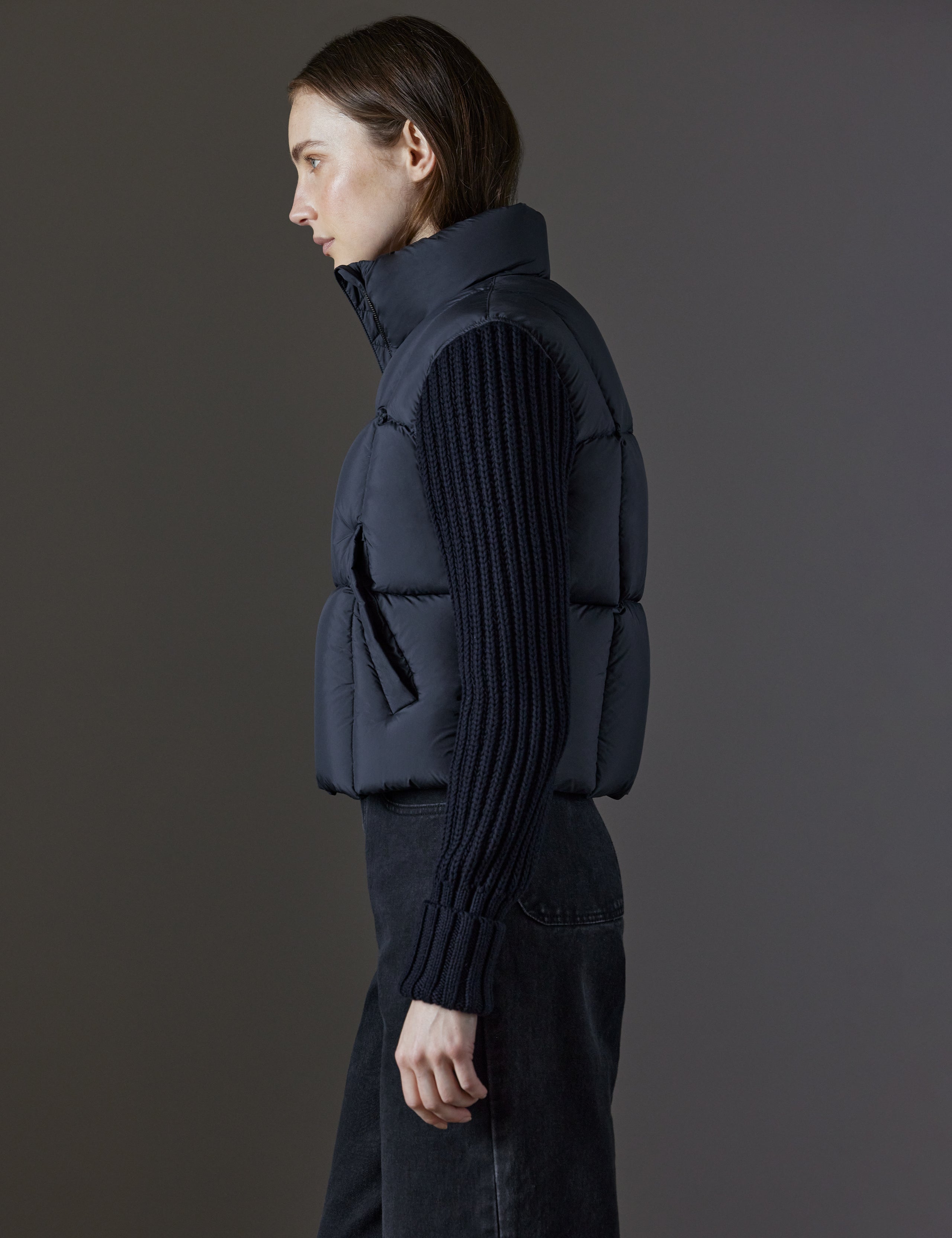Side profile view of woman wearing Nina Cardigan-Sleeve Jacket in Onyx Black from AETHER Apparel.