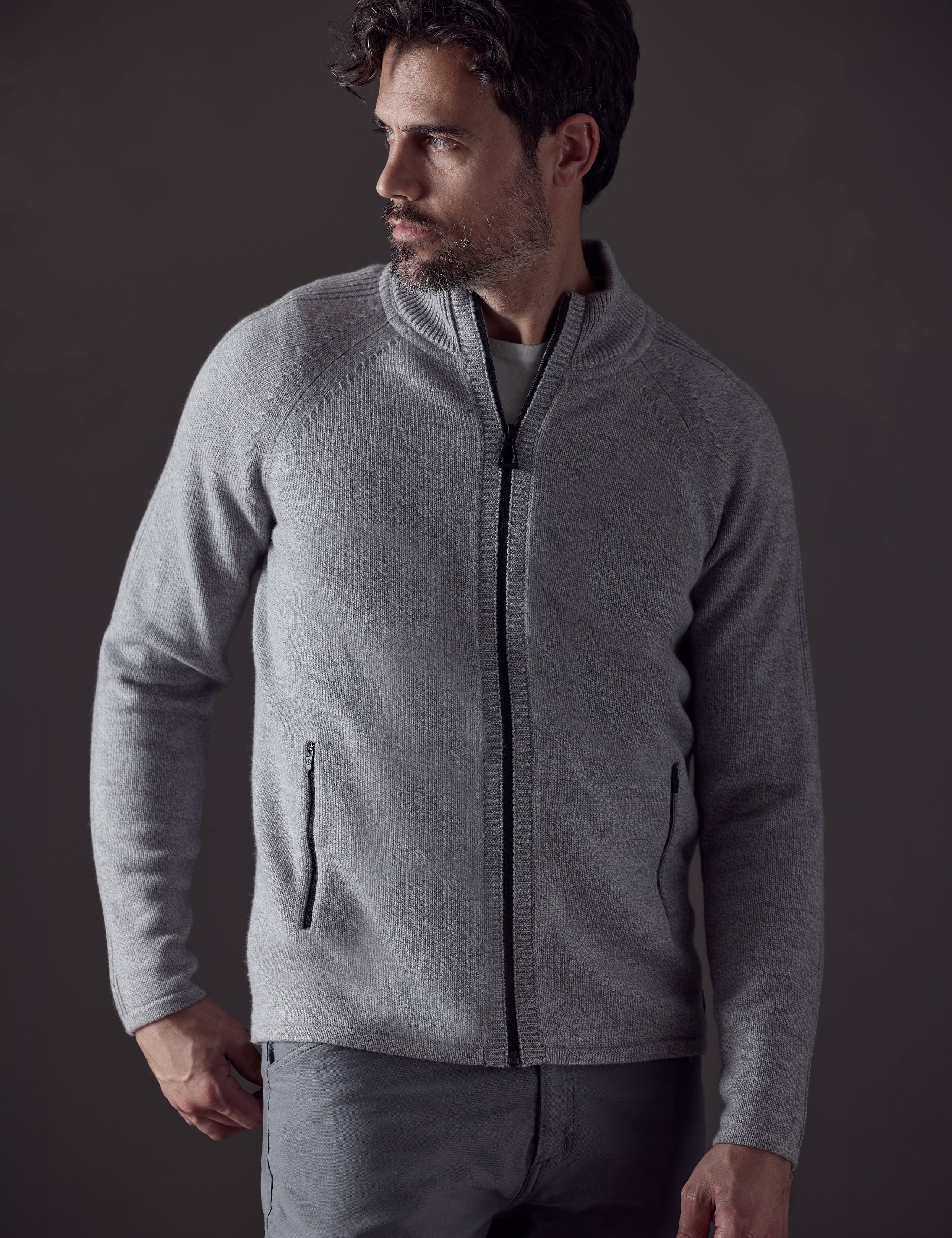 Front body view of man wearing Riley Full-Zip Sweater in Light Heather Grey from AETHER Apparel.