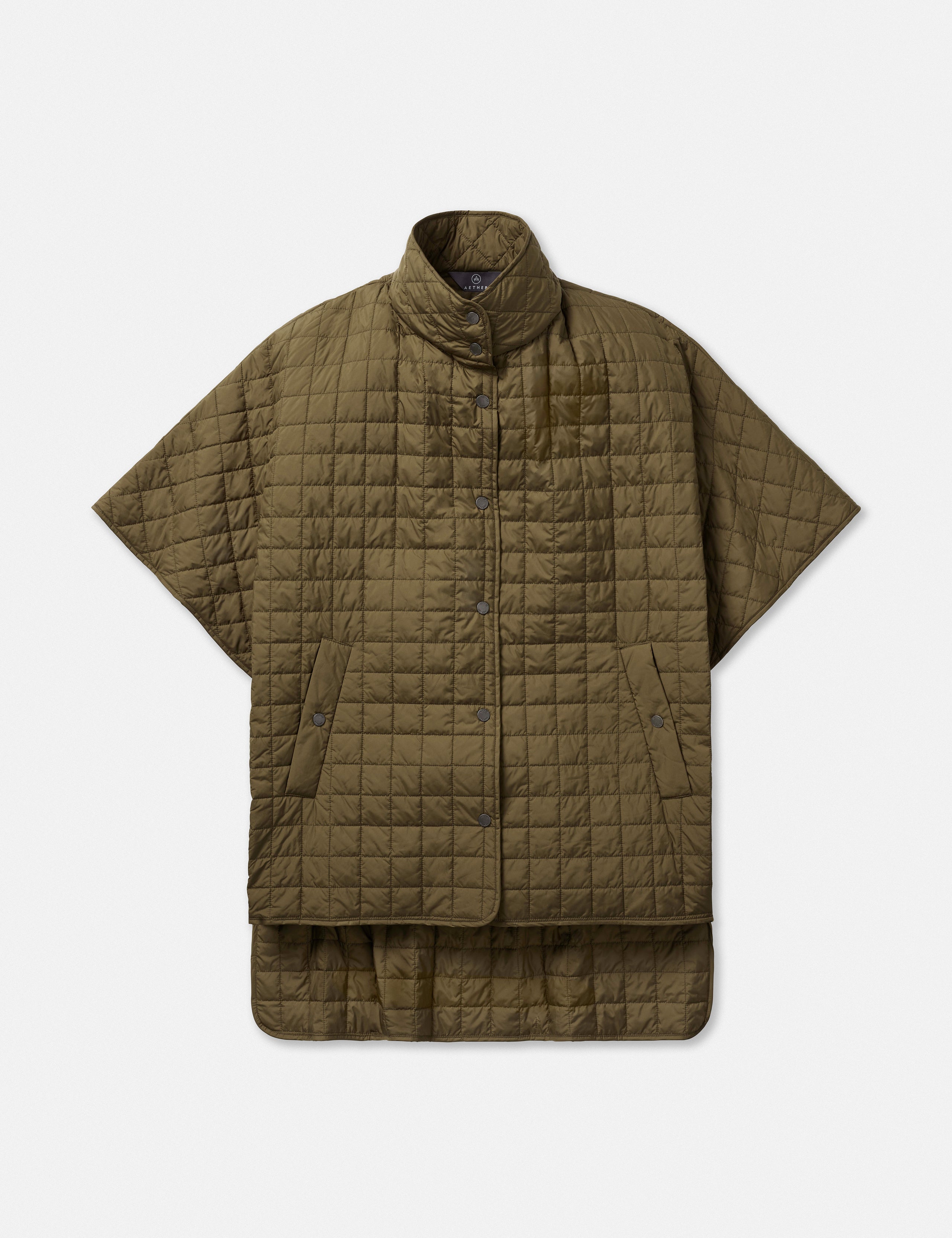 Flat lay of women’s Bardo Poncho Jacket in Command Green from AETHER Apparel.