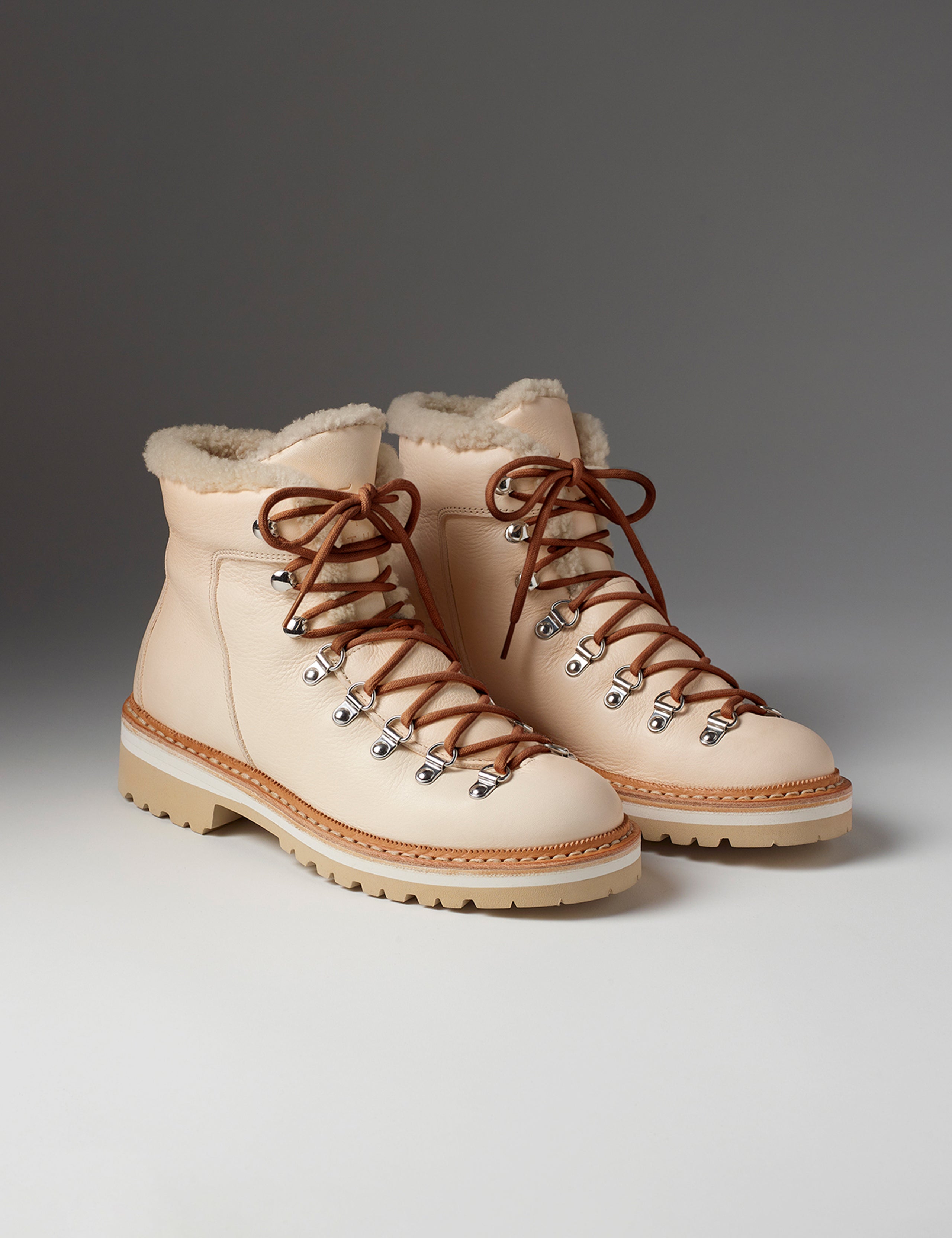 Front angled view of women's Dolomite Boot with Shearling in Cream from AETHER Apparel with brown laces.